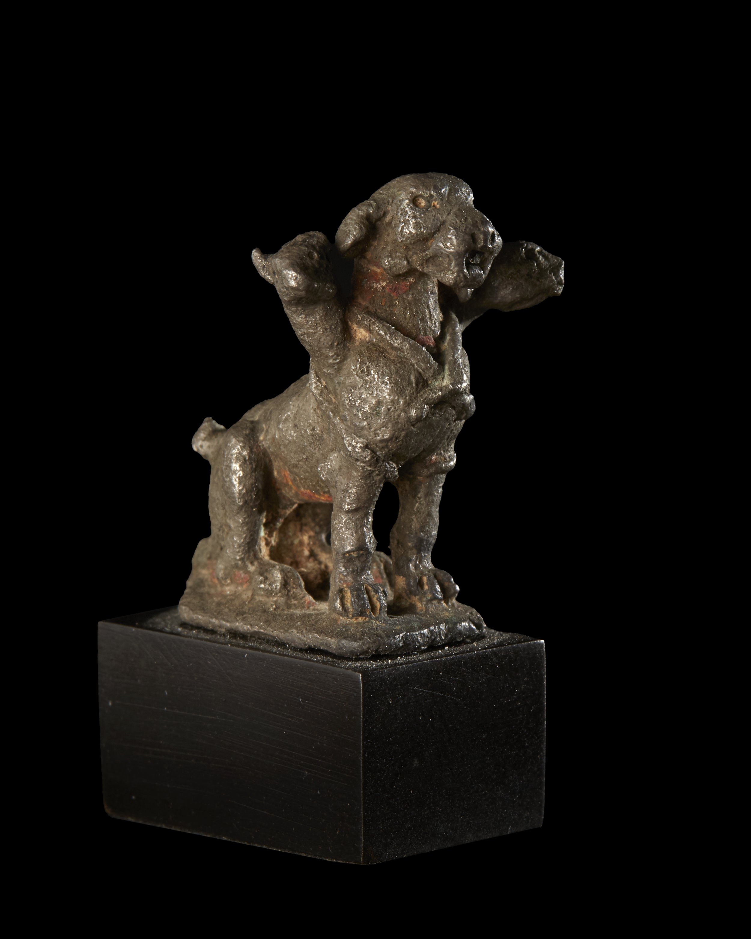  A Roman silver statuette of Cerberus , c. 1st-2nd century AD 
silver 
height: 3.4 cm
