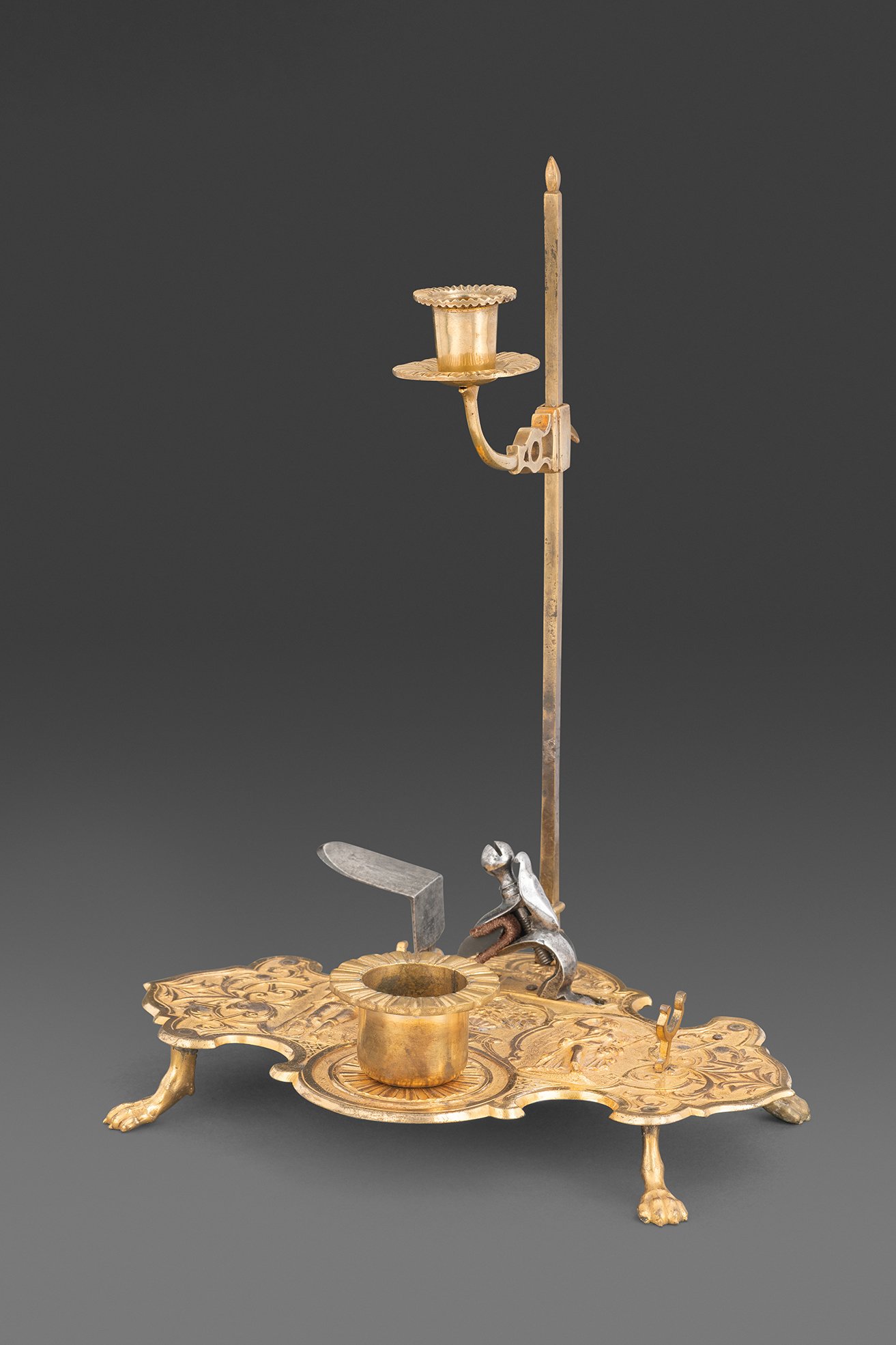  A Fine Carlsbad Gilt-bronze Strike-a-Light, Candle-holder and Inkstand for a Writing Desk , c. 1740–60 
steel, gold, copper alloy (bronze) 
28 cm x 21 cm (11 in x 8.3 in.)
