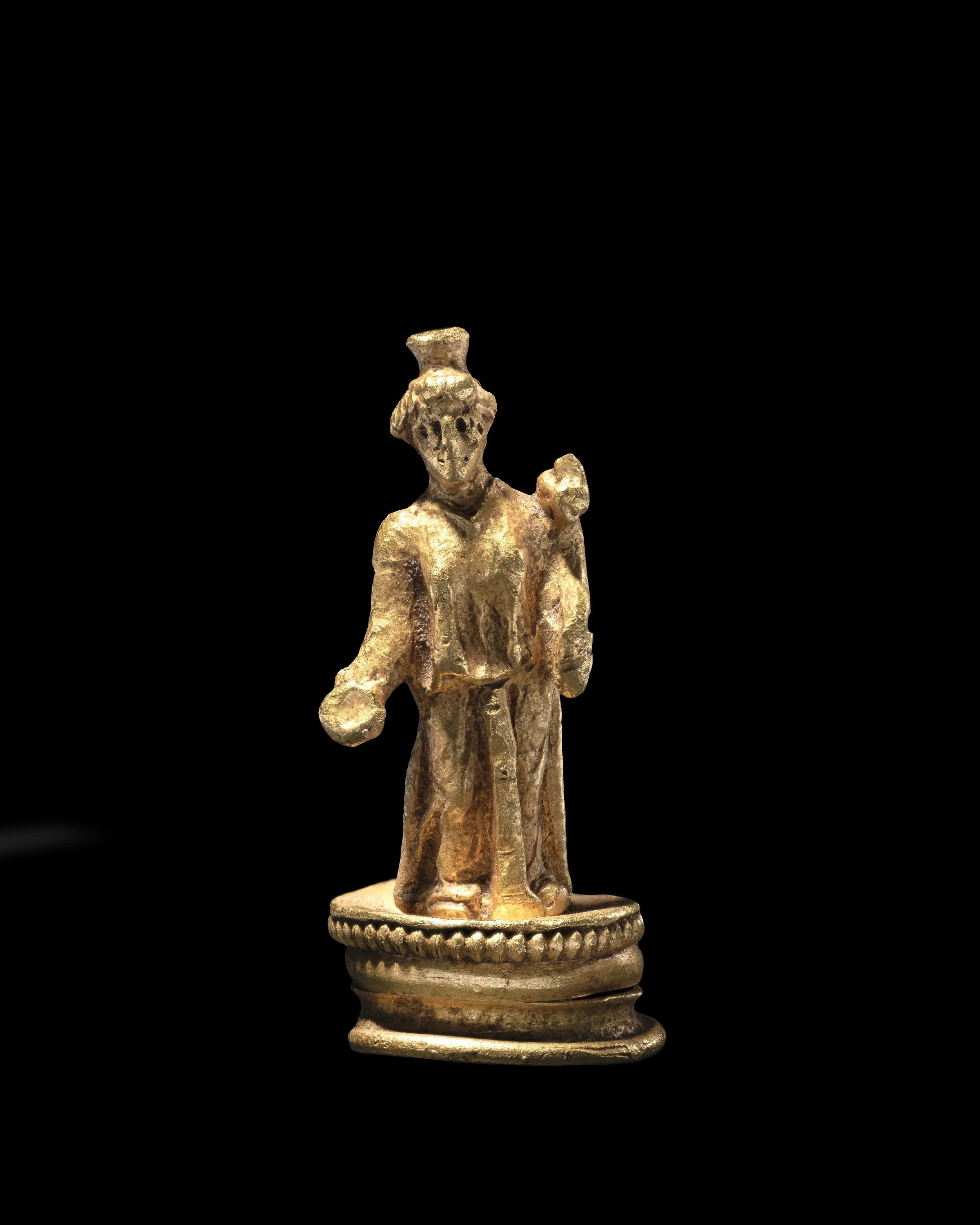  A Roman gold statuette of the goddess Fortuna,   c. 1st–2nd Century AD 
gold 
height: 2.4 cm