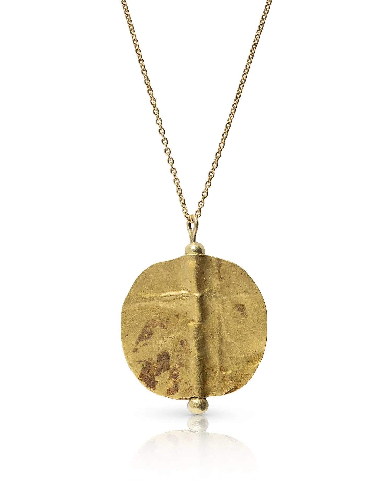  A Mesopotamian gold disc bead set in a modern gold necklace , c. 3rd millennium BC 
gold 
height of ancient bead: 2.4 cm
