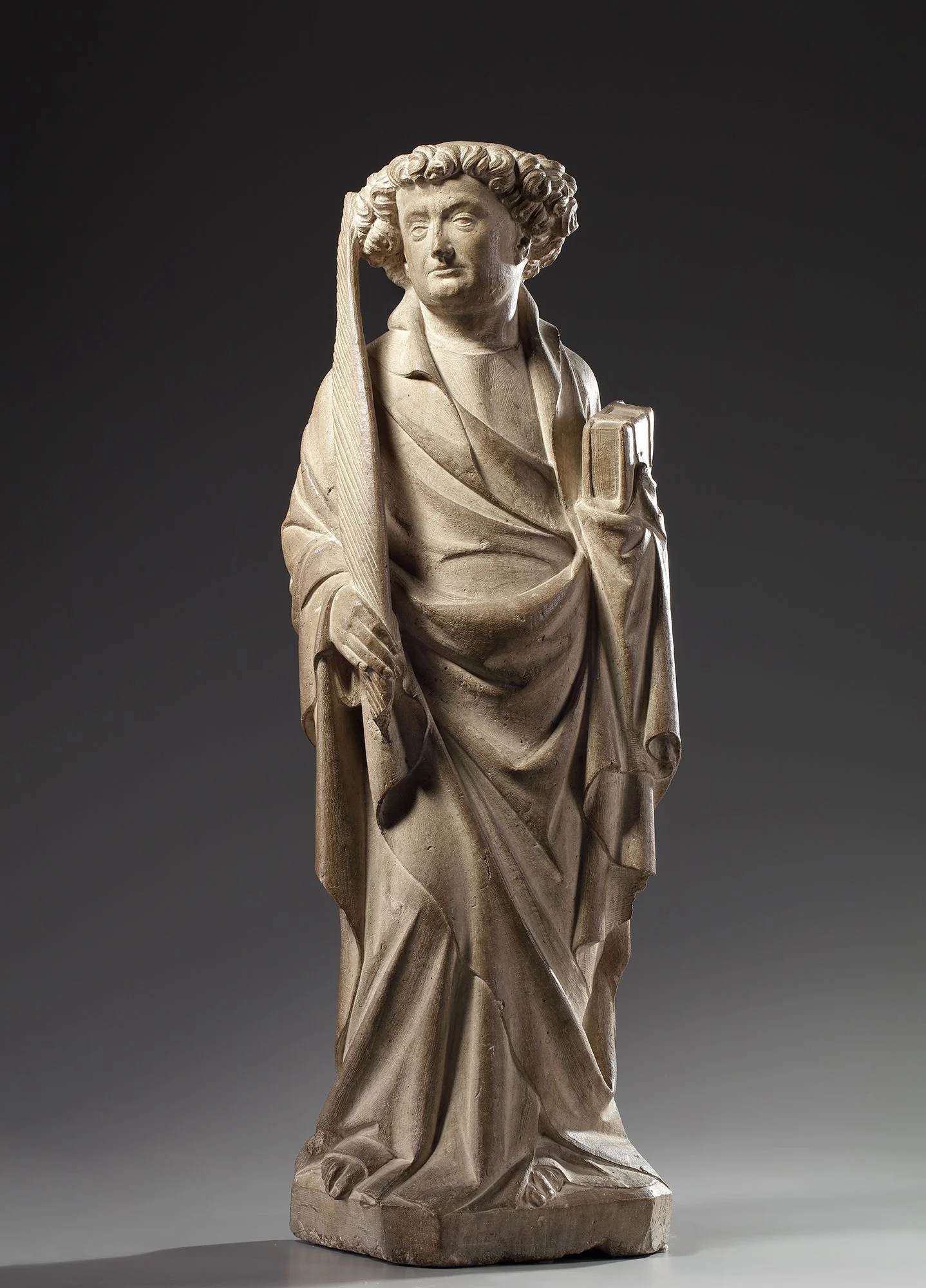 WORKSHOP OF CLAUS DE WERVE (Haarlem, c. 1380–1439, Dijon) 
 Deacon Saint , c. 1410–1430 
limestone 
81.5 x 26.3 x 20.4 cm