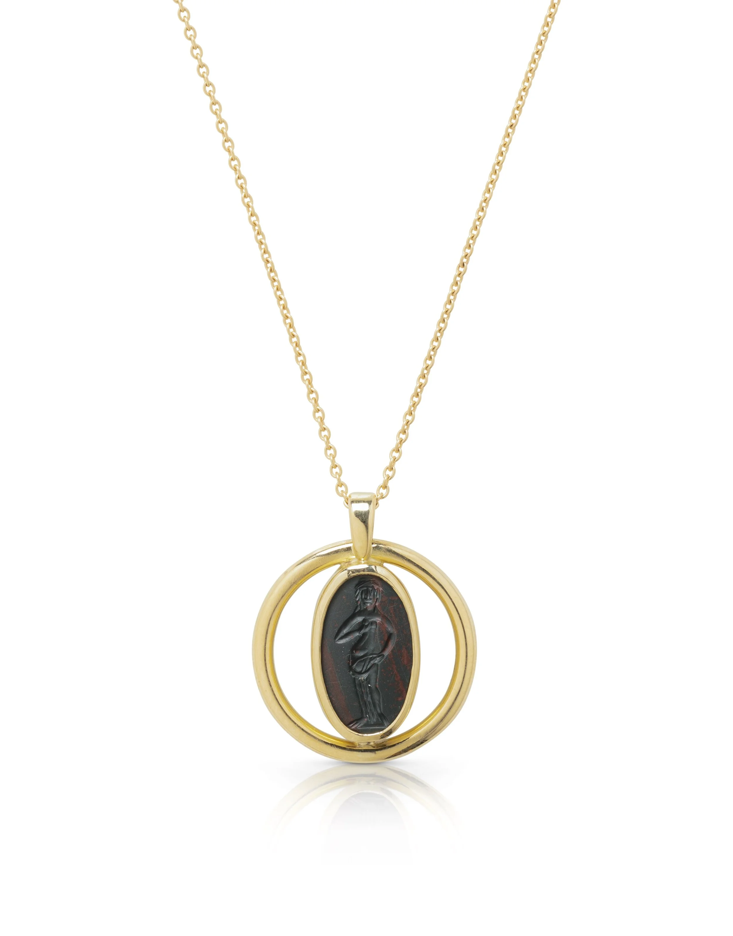  A Roman heliotrope intaglio of Venus set in a modern gold pendant , c. 2nd–3rd century AD 
heliotrope, gold