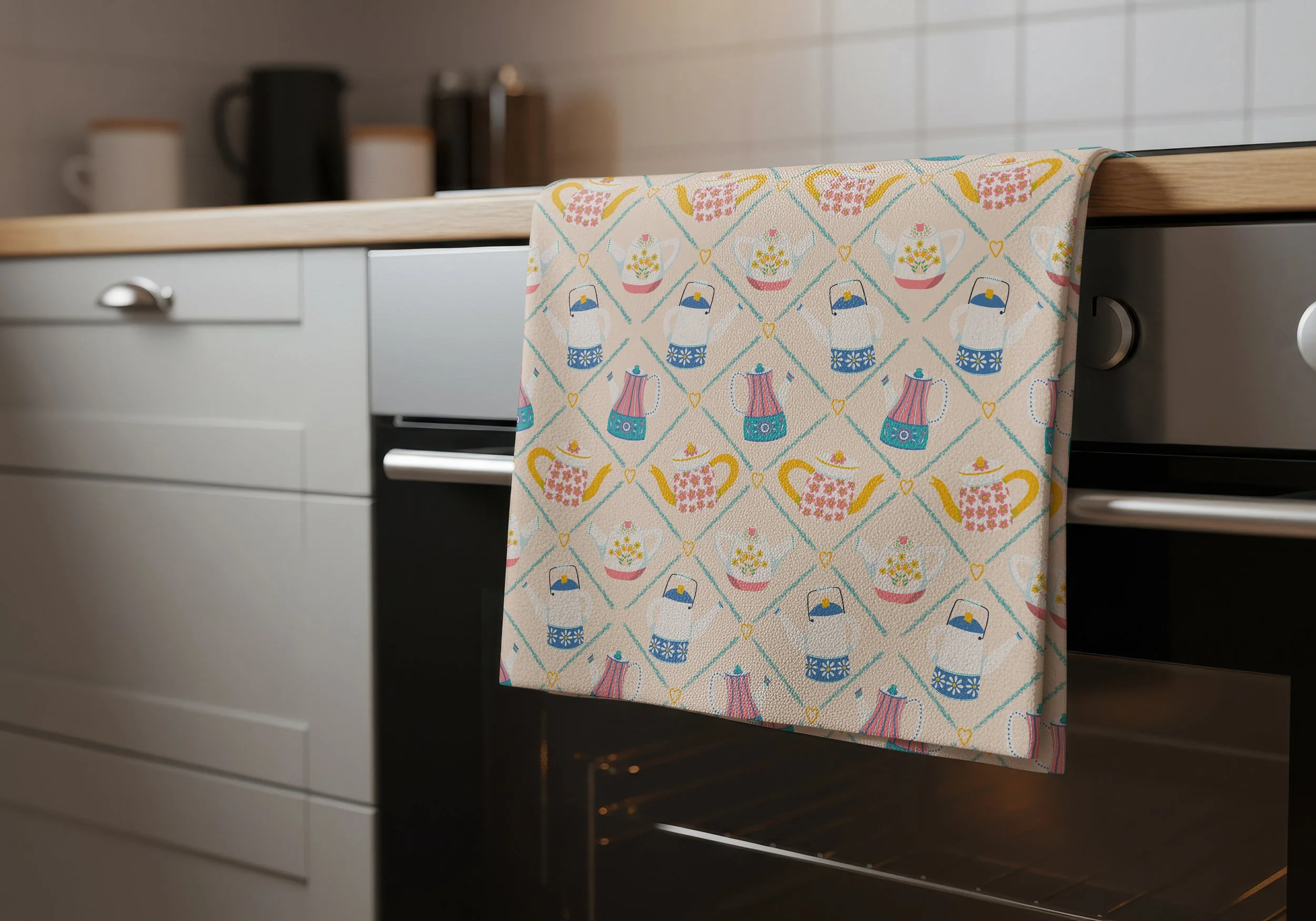 Teatowel with Teapots Repeating Pattern on a Kitchen Counter