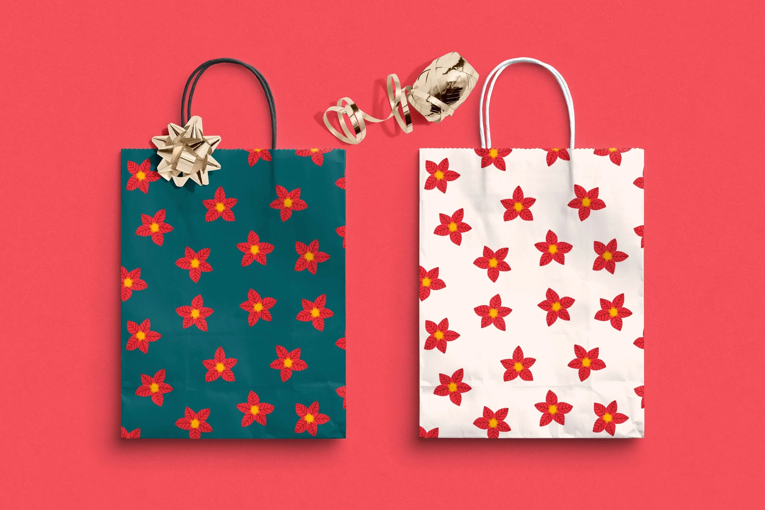 Two gift bags featuring a repeating poinsettia pattern, one with dark green background and one with a light ecru background. The green bag has a gold bow and at the top of the bags there is a ball of red ribbon.