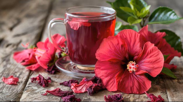 hibiscus-tea-glass-cup-fresh-red-jamaica-flowers-roselle-rosella-wooden-table-background_35691-20476.jpeg