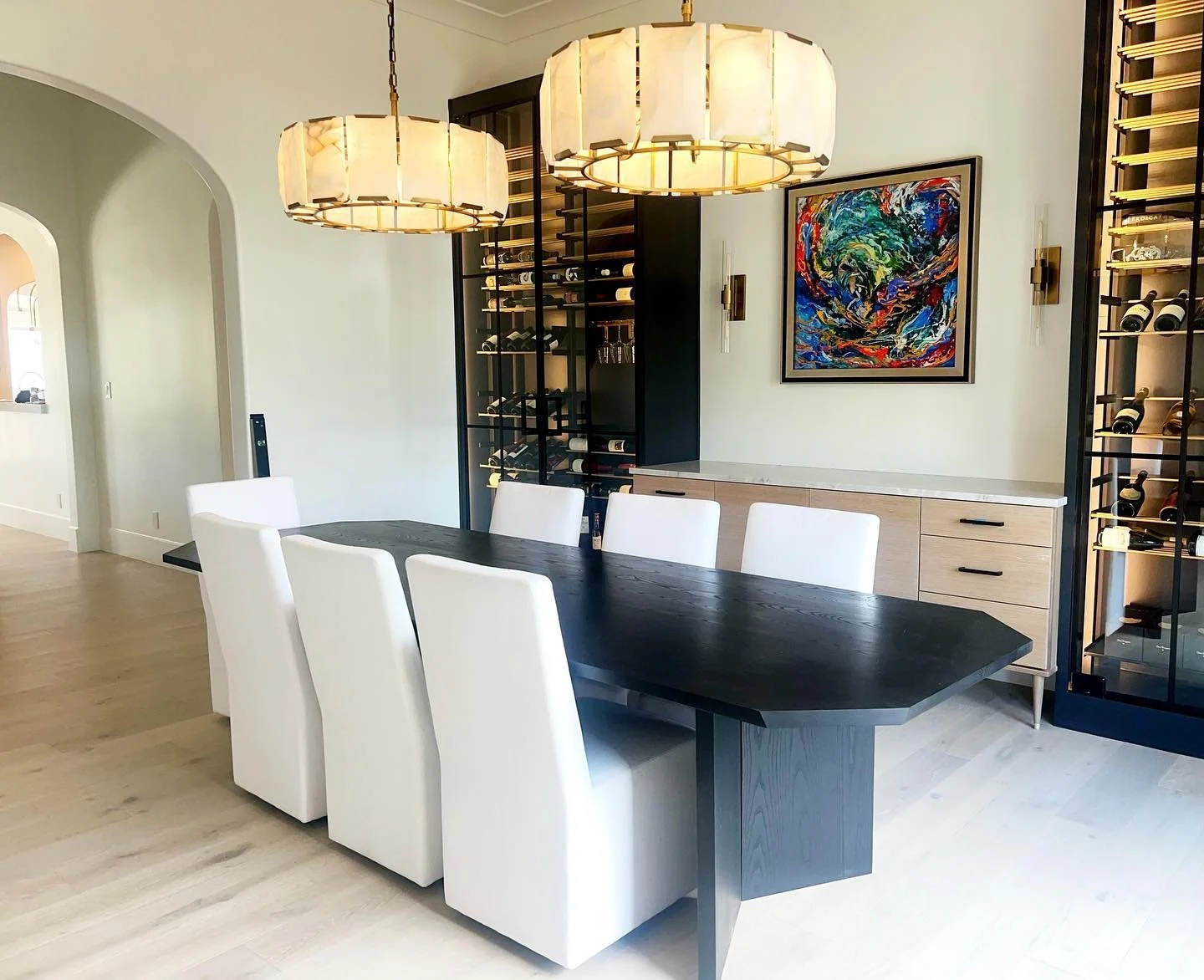 Here&rsquo;s a statement maker of a table to get you into the weekend 🤩. A custom designed 10&rsquo; long ebonized ash dining table, surrounded by such beautiful chairs, lighting and decor.  Shots like this, in homes like this, for amazing clients i