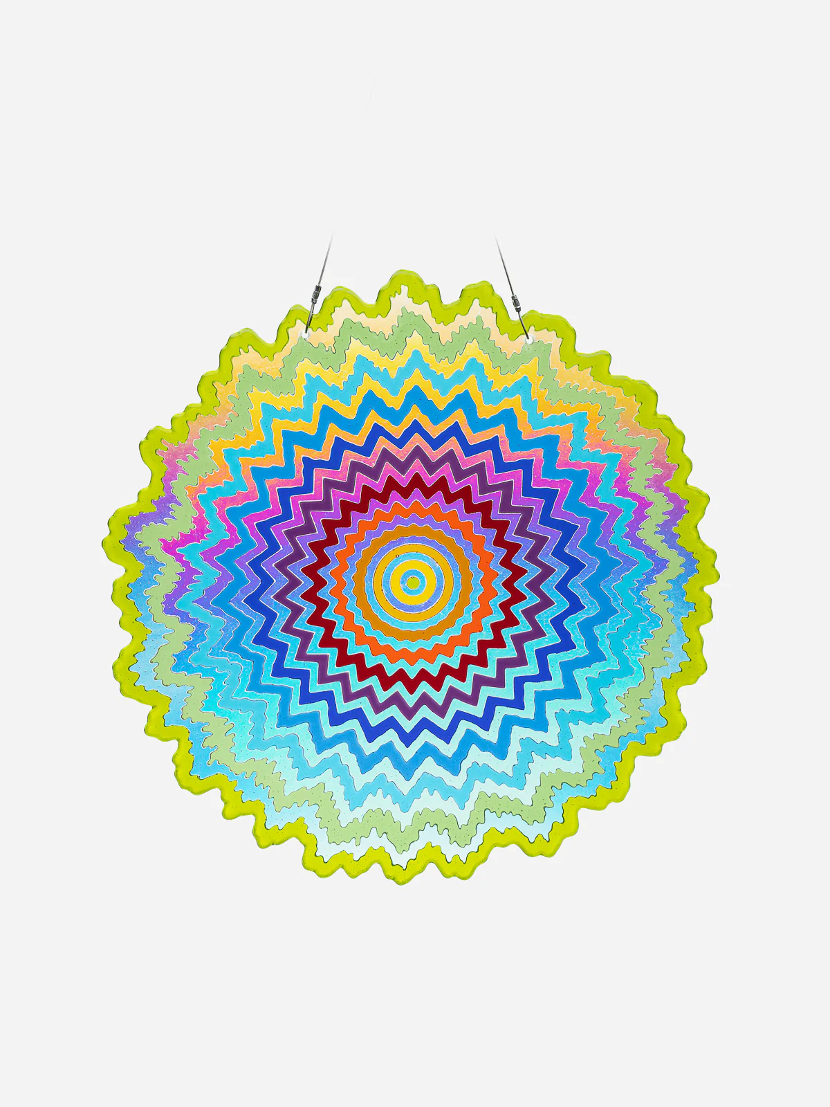 Colorful circular parasol with a vibrant zigzag pattern in multiple colors, hanging against a white background.