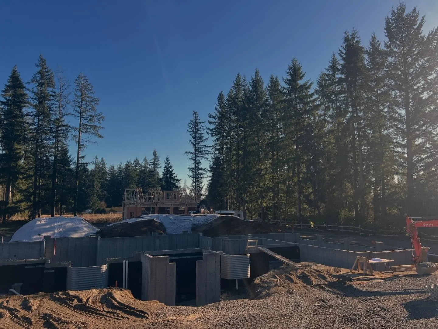 Doesn&rsquo;t get much better than a sun-filled Friday afternoon! ☀️🔨 Checked in at our Langley custom build&mdash;the framing on the shop is coming together while we&rsquo;re dialling in the drain tile on the main house.  #bringingitalltogether
