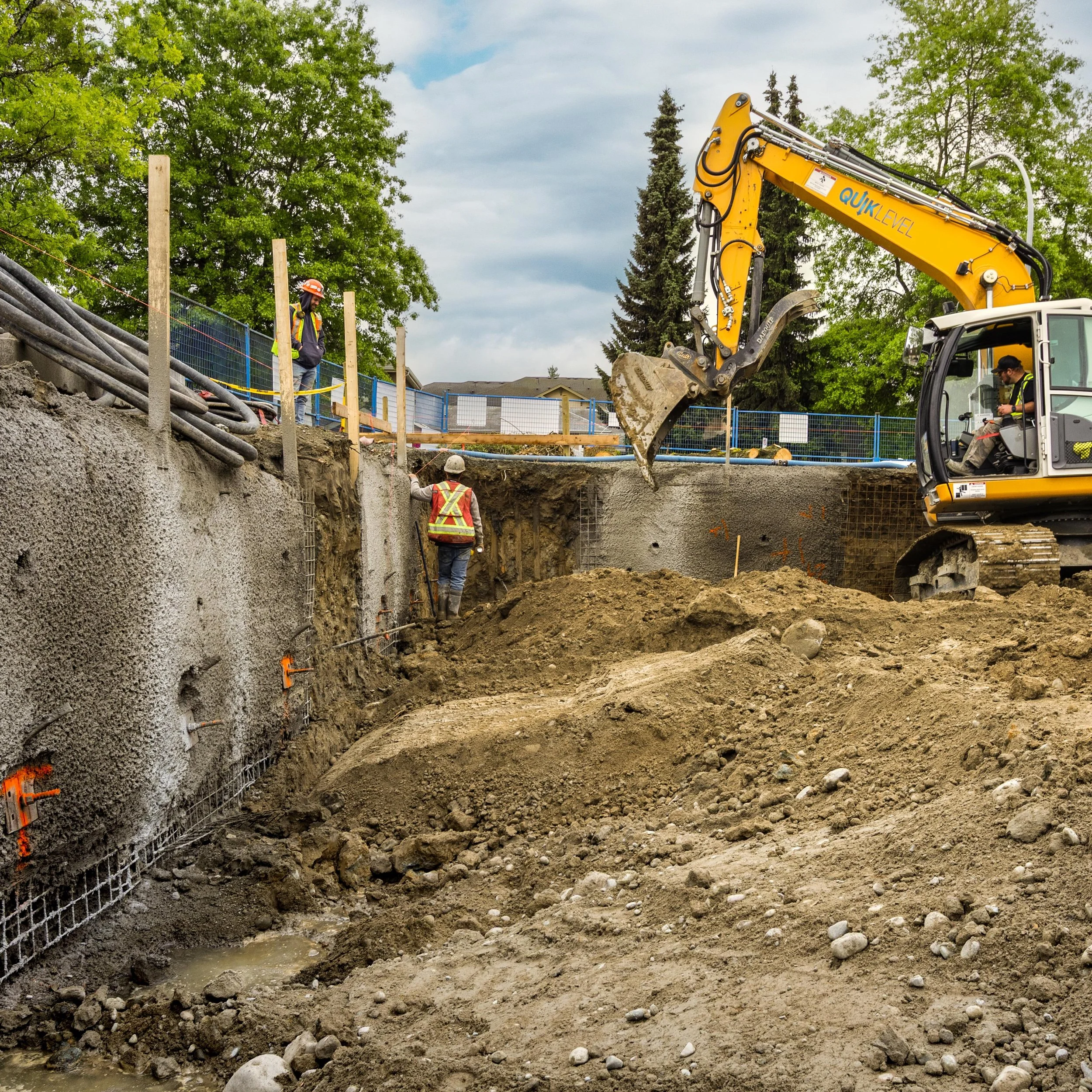 Shoring and initial concrete pours are well underway! Over 1,000 cubic yards hauled daily during bulk excavation under beautiful skies. Grateful for the weather and proud of the crew making it happen. Onward and upward! 

#BringingItAllTogether 
#Sho