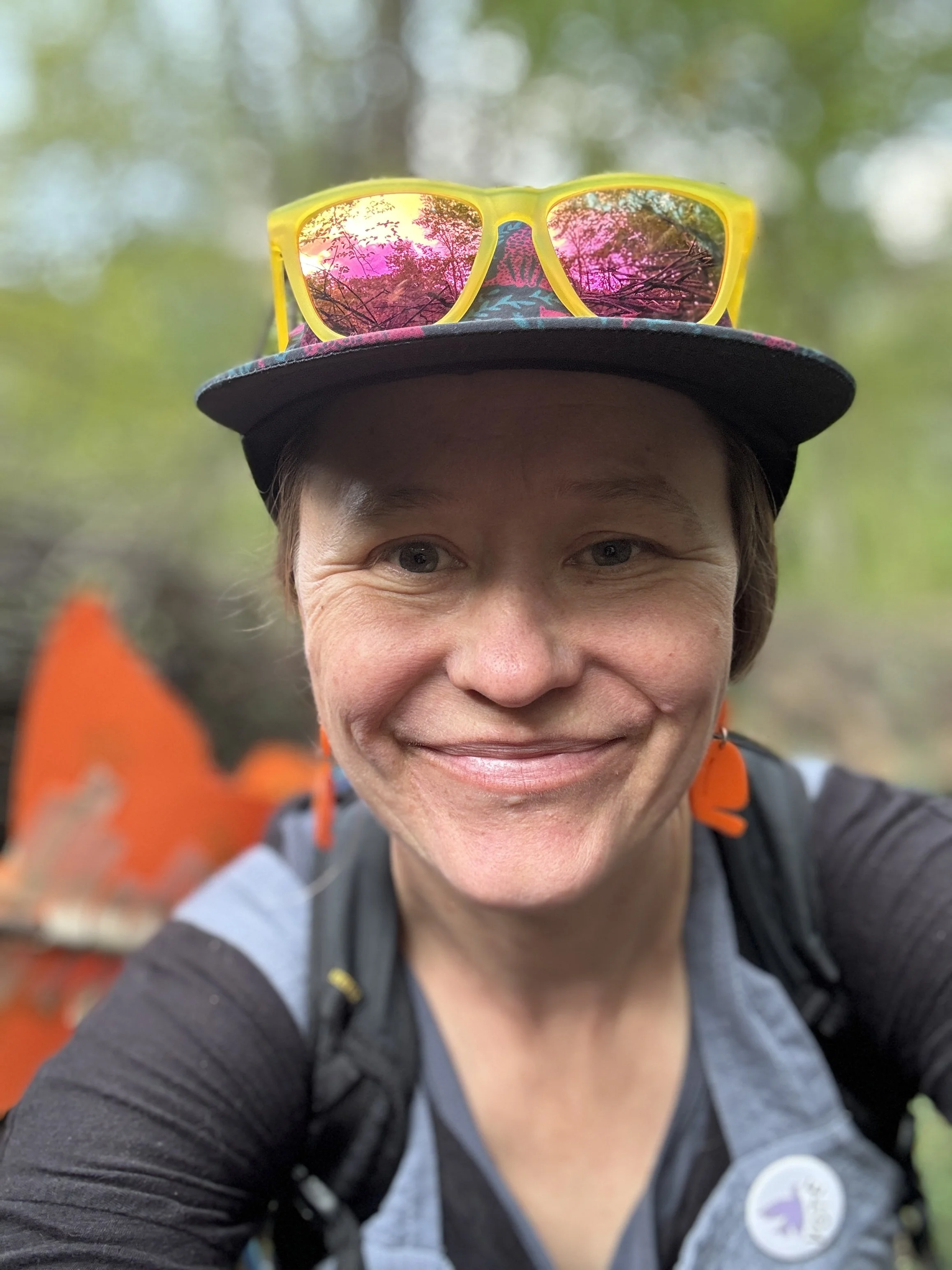 Close up of Sarah Weeks with a hat and sunglasses on her head
