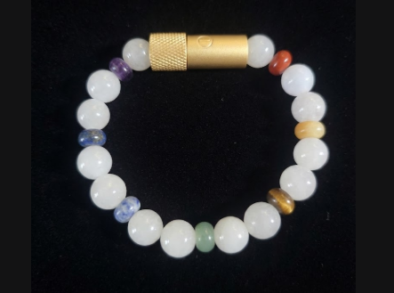 Enusia 7 chakra bracelet with white jade and gold pill holder vessel
