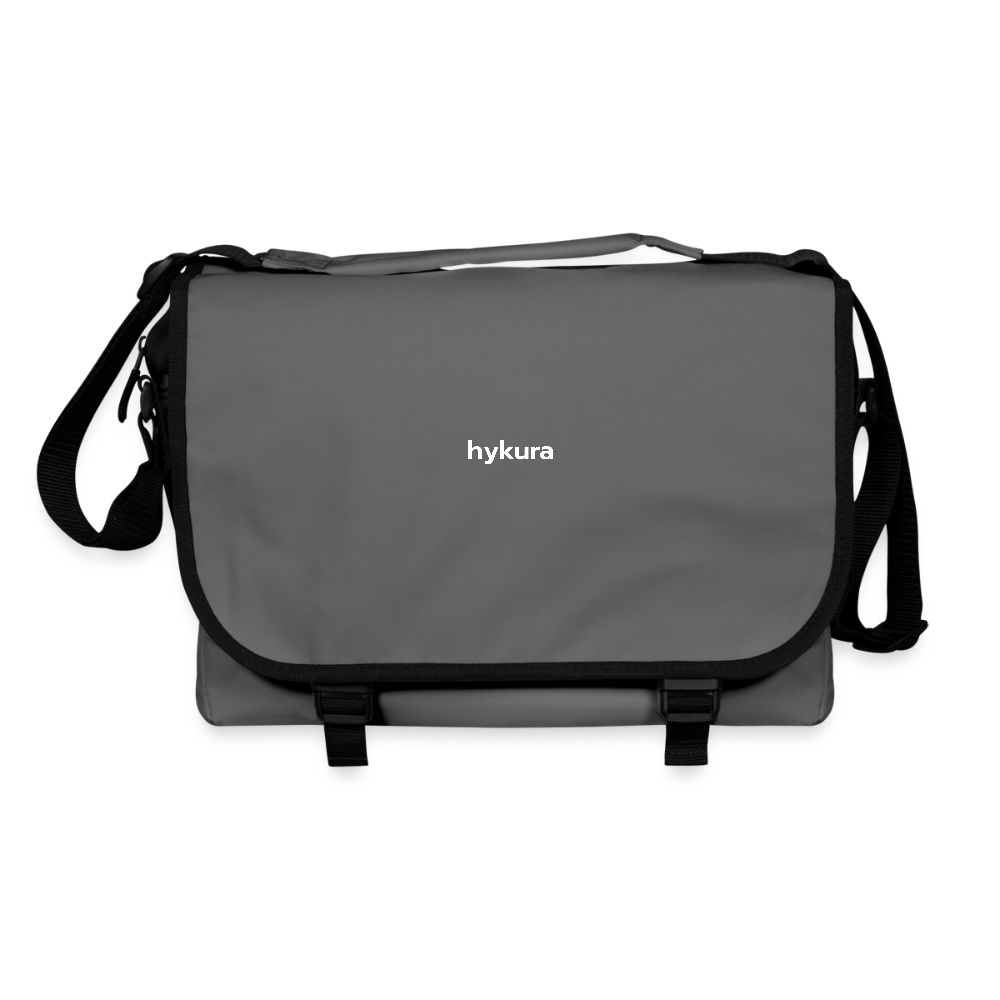 In graphite, the Stride Crossbody Bag by Hykura offers smart storage, snap-secure access, and a 15-litre interior for busy lives on the go.
