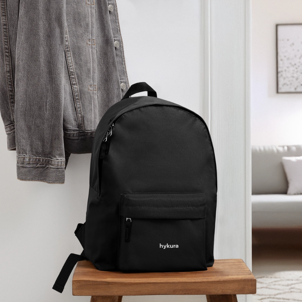 In black, the Venture Pack by Hykura combines roomy storage and a handy headphone port, perfect for school, work, or travel.