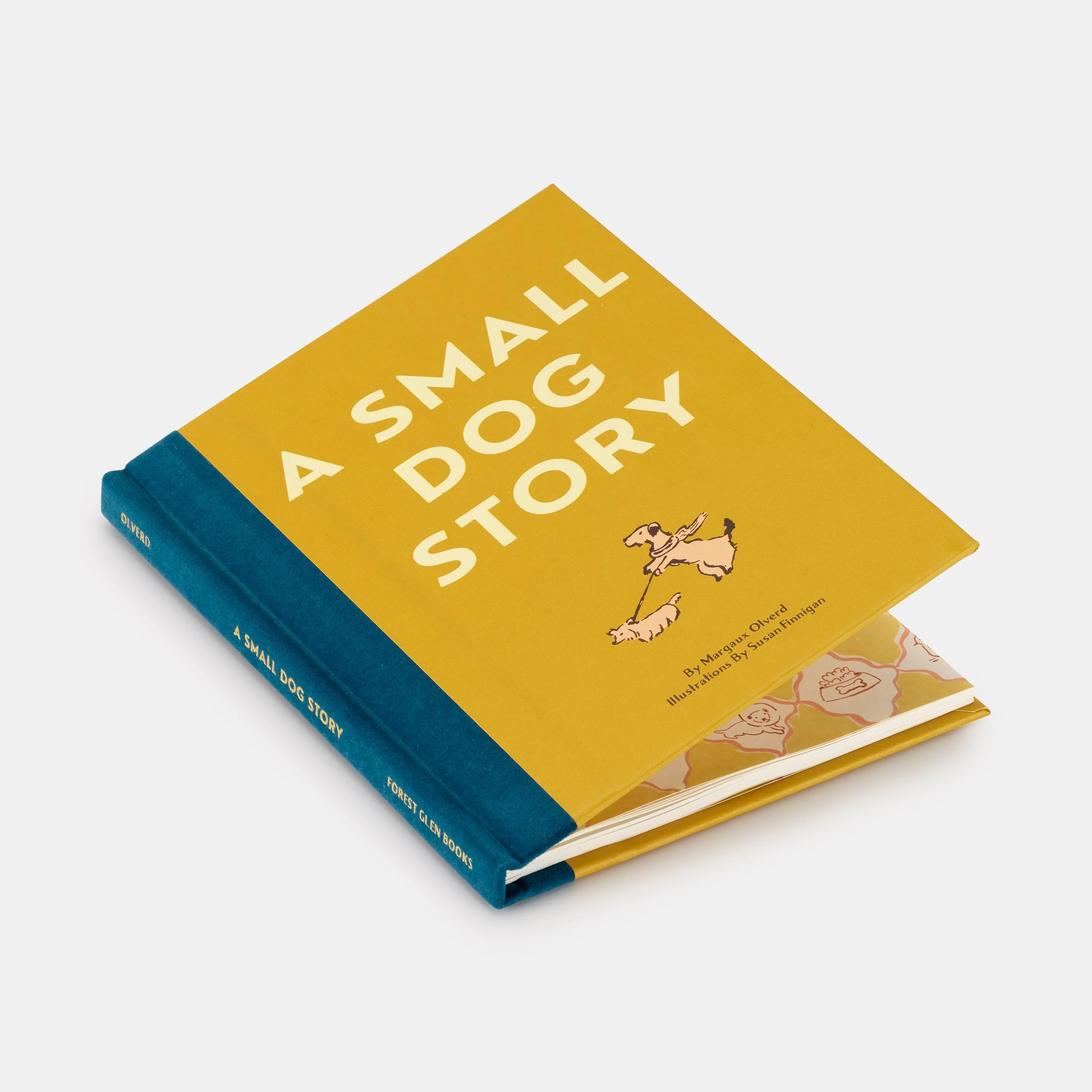 "A Small Dog Story" book with yellow cover and illustration of dogs, blue spine.