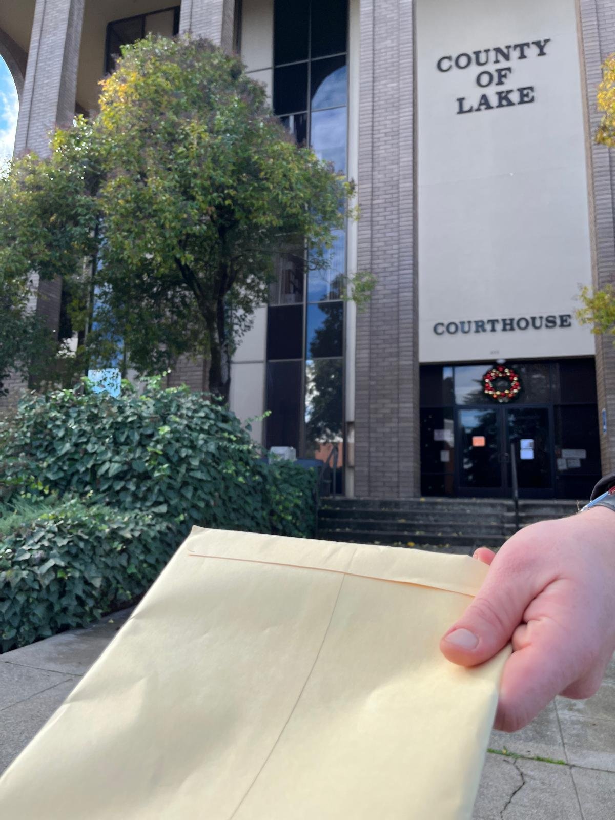 Lake County courthouse in Lakeport, California with eviction and legal documents held by Redwood Lakes Legal Documents process server