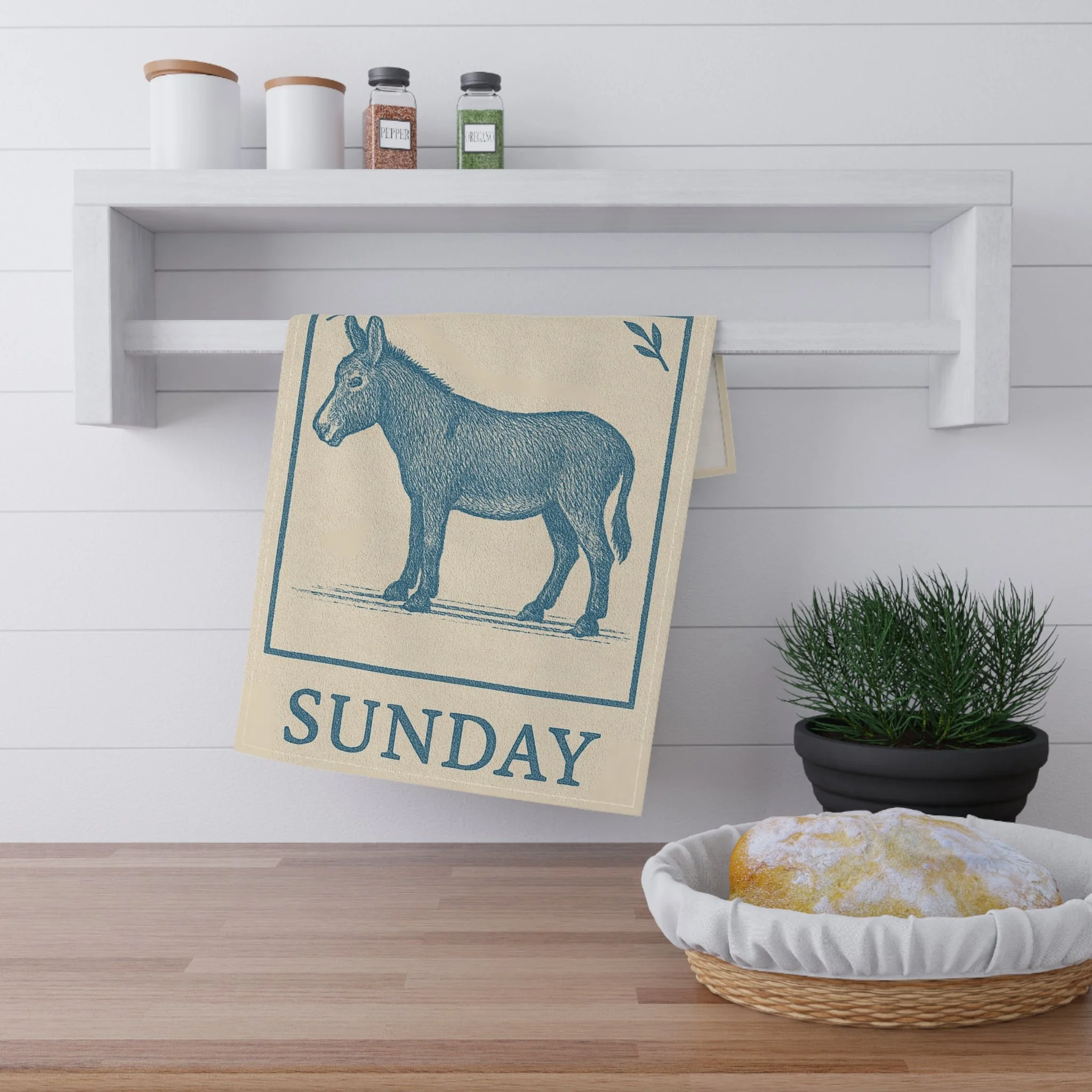 Donkey Tea Towel in Block Print Blue hanging on a towel bar