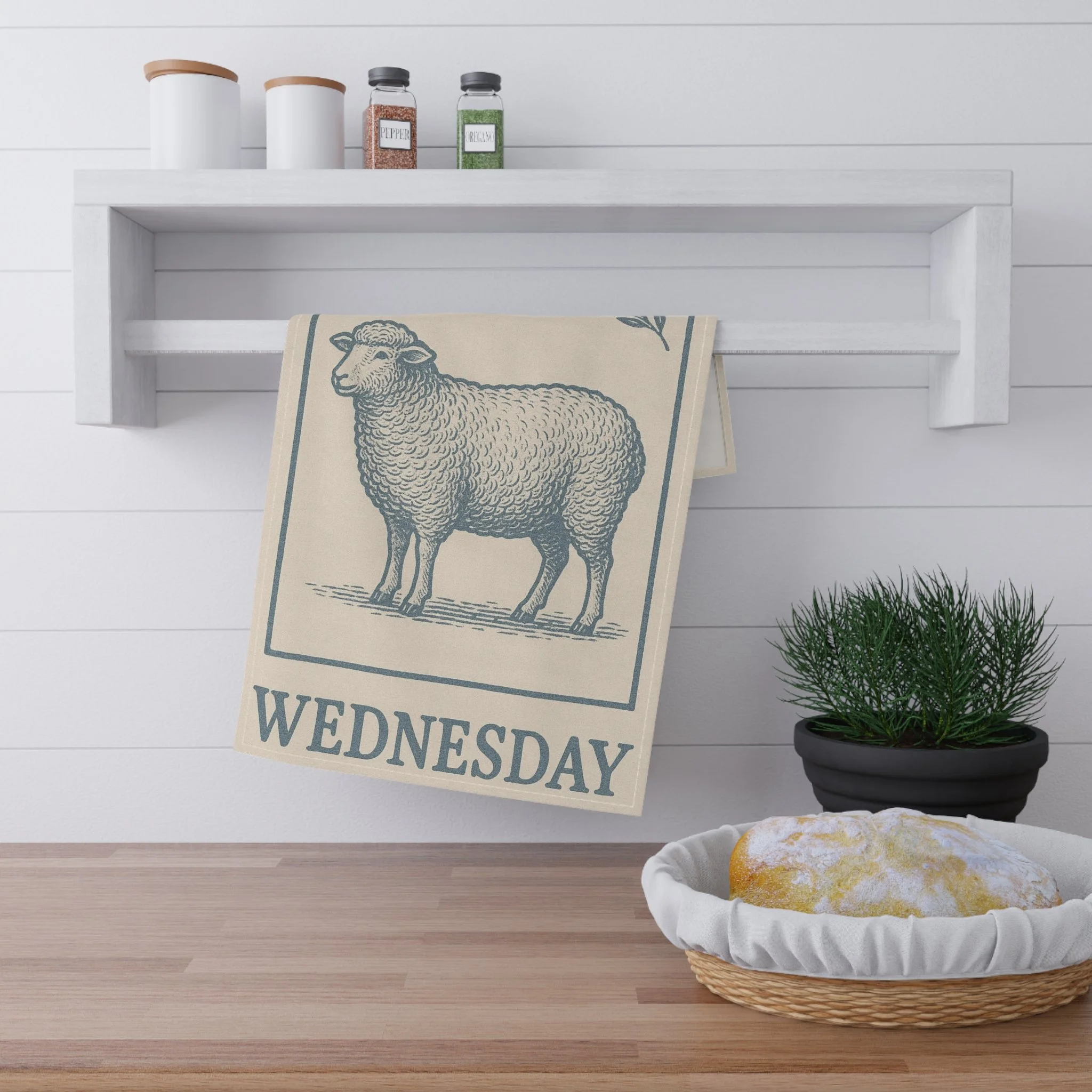 Sheep Cotton Dish Towel hanging on a towel bar