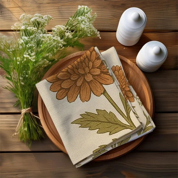 autumn flowers and thistles napkin folded on wooden plate