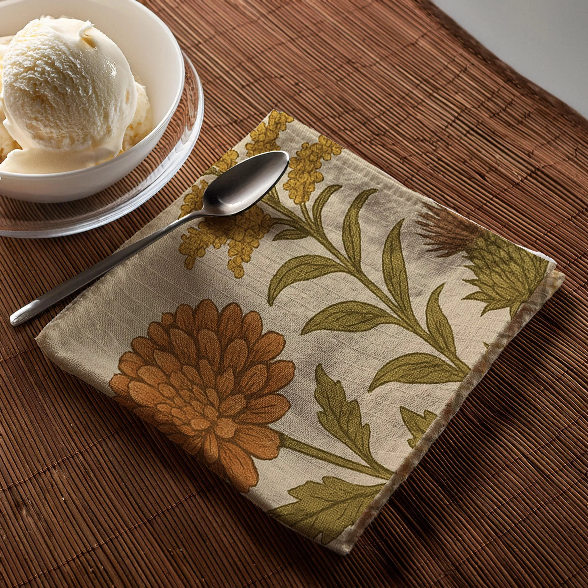 autumn flowers and thistles napkin folded with ice cream and swpoon