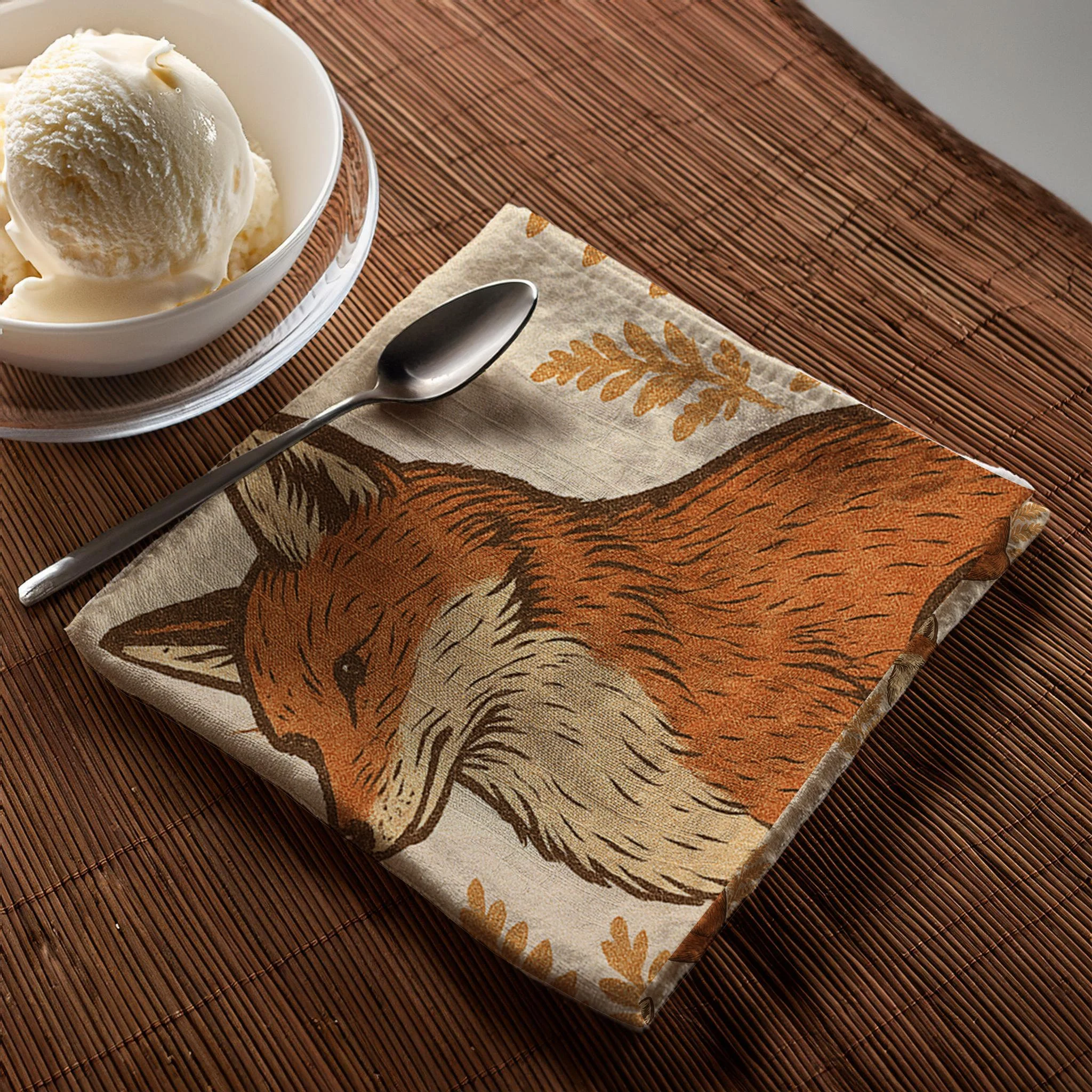 fox napkin with icecream and spoon on table