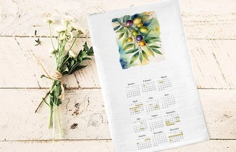 olives and branches calendar on table with flowers