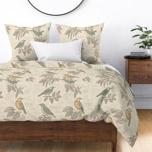 hand drawn birds on branches with handwriting on bedding