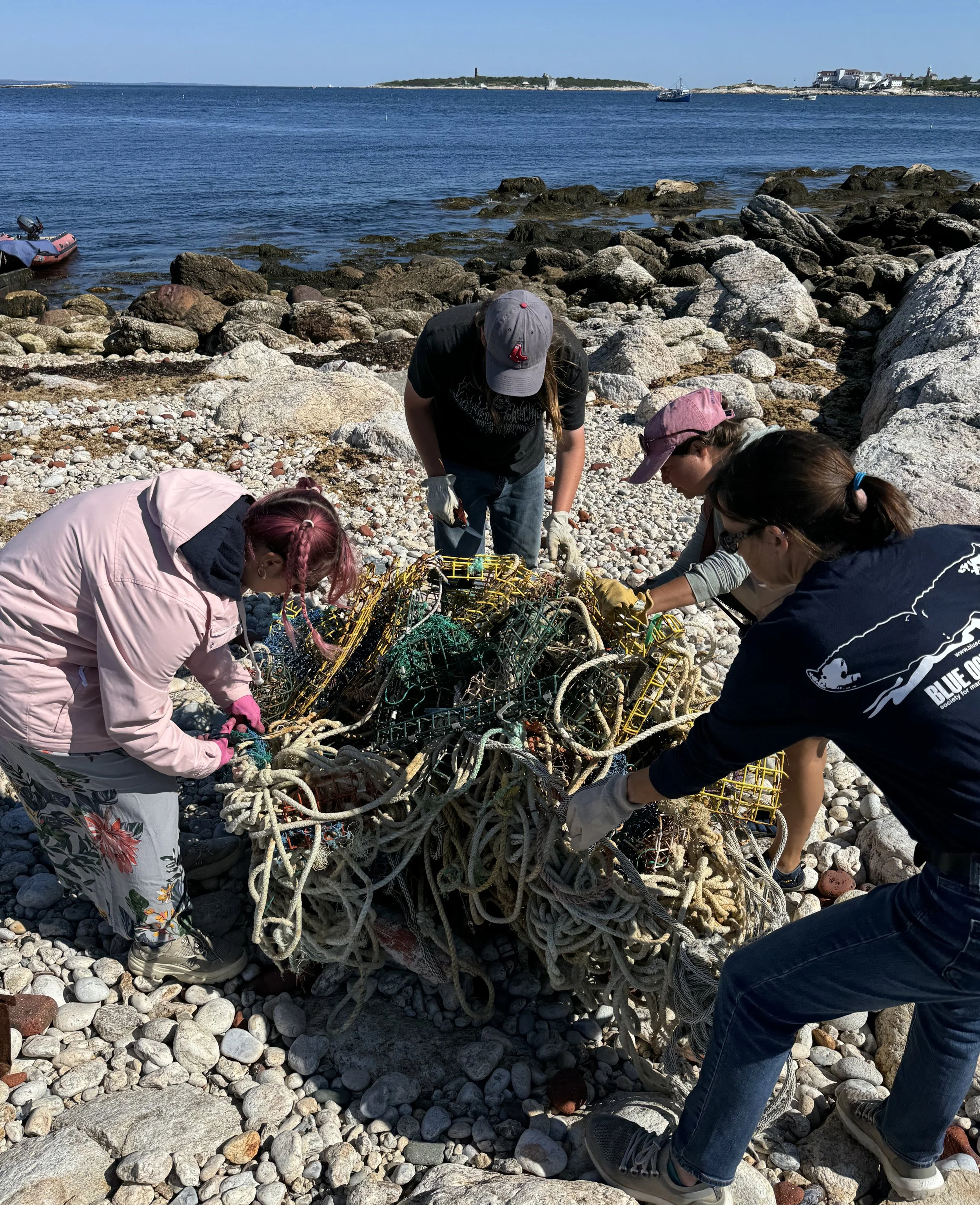Staff and volunteers from Blue Ocean Society removing lobster traps from White Island in the Isles of Shoals