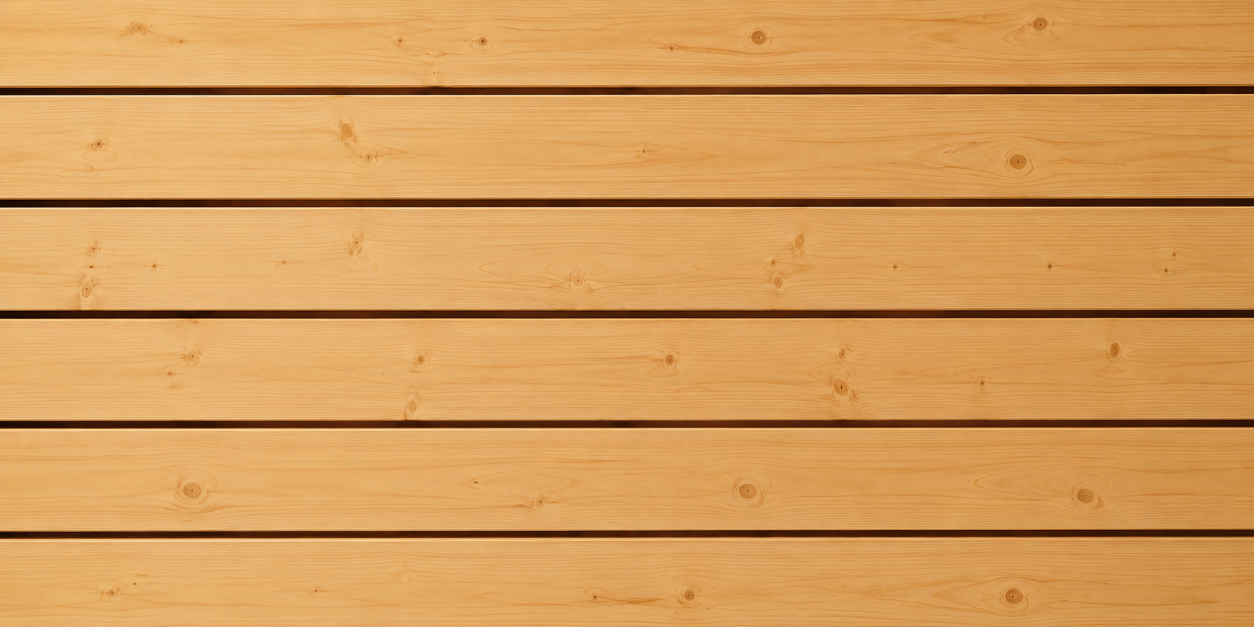 Nordische Fichte als hochwertiges Saunaholz mit natürlicher Maserung für moderne Wellnessbereiche und Saunen.