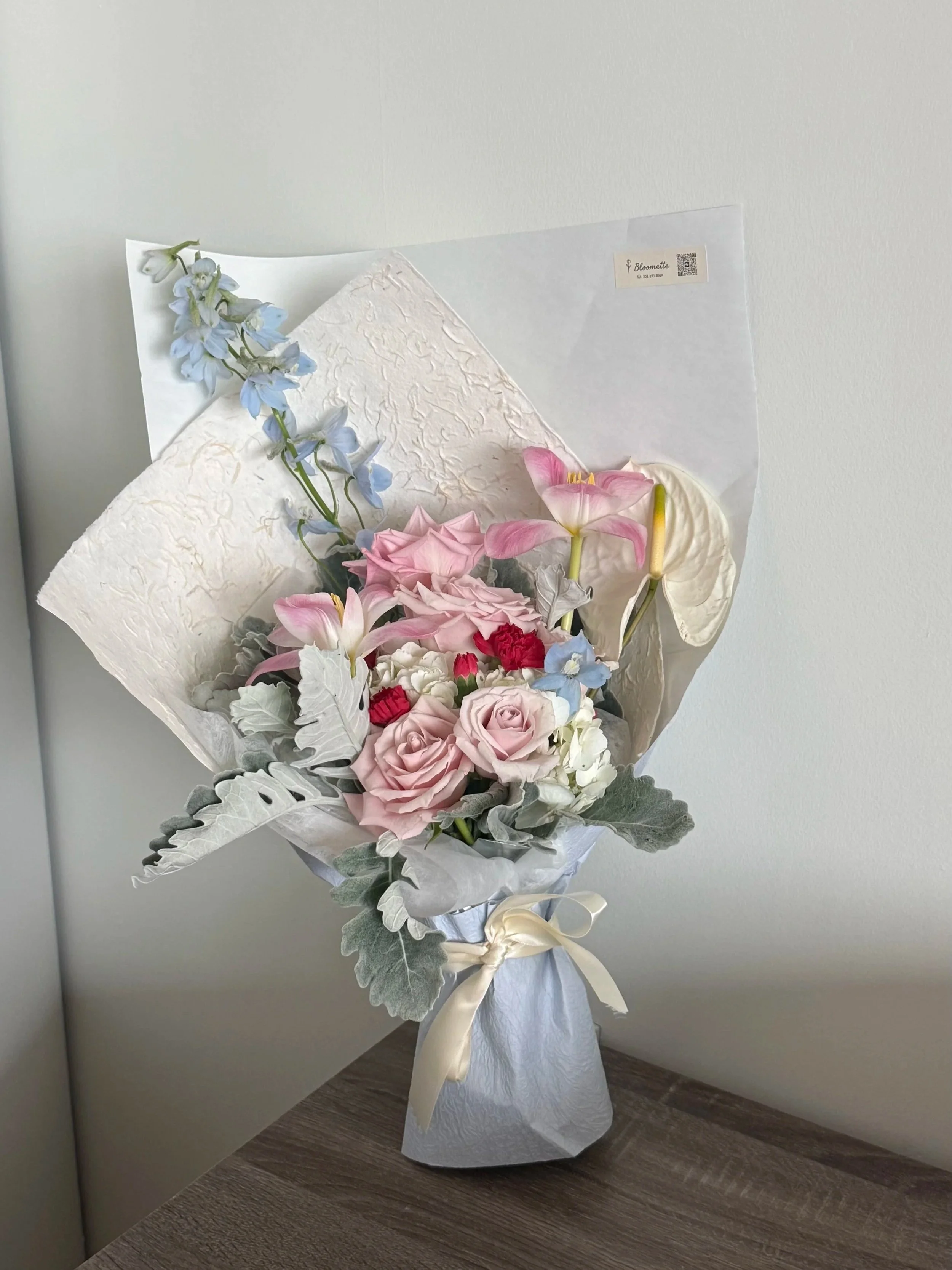 Inspired by a snowy day in New York,
soft tones and airy textures echo the stillness of falling snow.
Amid the cold, there’s a quiet warmth, something gentle, held close, and meant just for her.