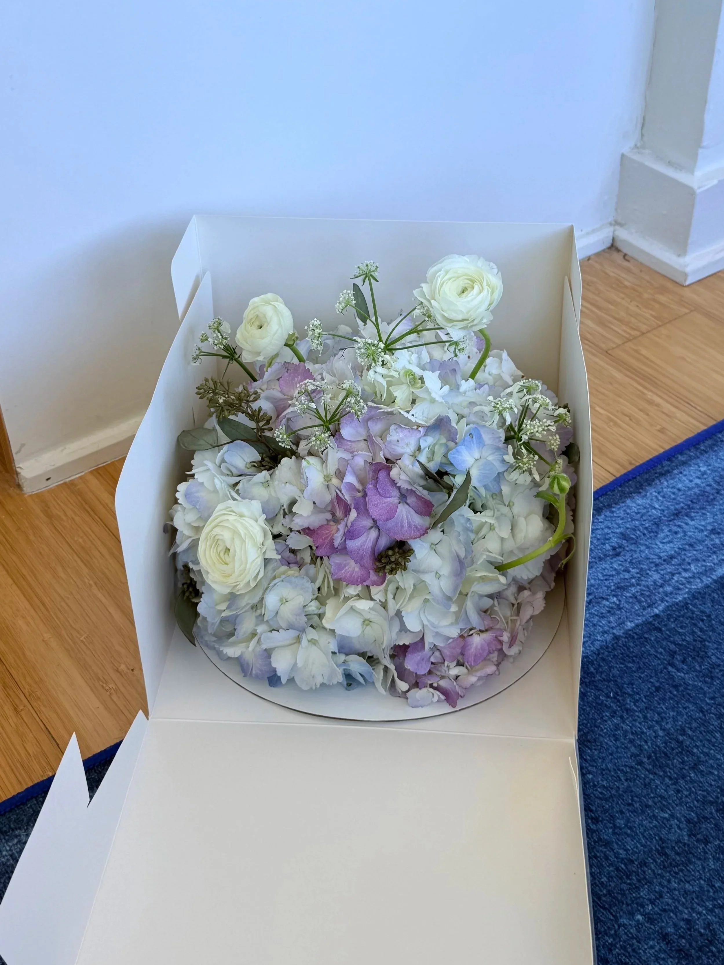 A floral take on a cake, something to hold onto a little longer.
While a cake fades quickly, this keeps the celebration in bloom, gathering sweetness and beauty in a lasting way.