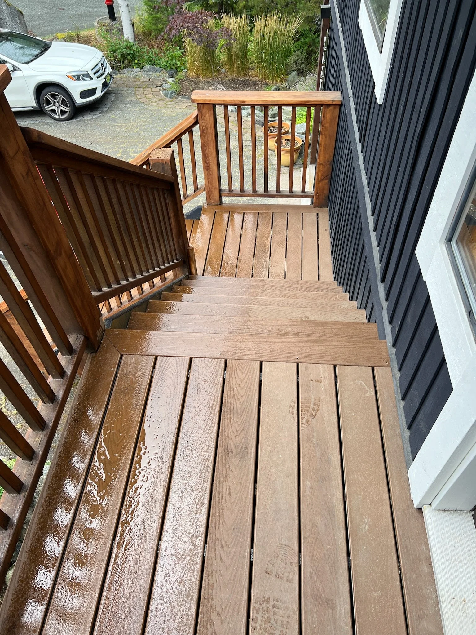 An outdoor staircase in Whistler after a fresh renovation with handrails