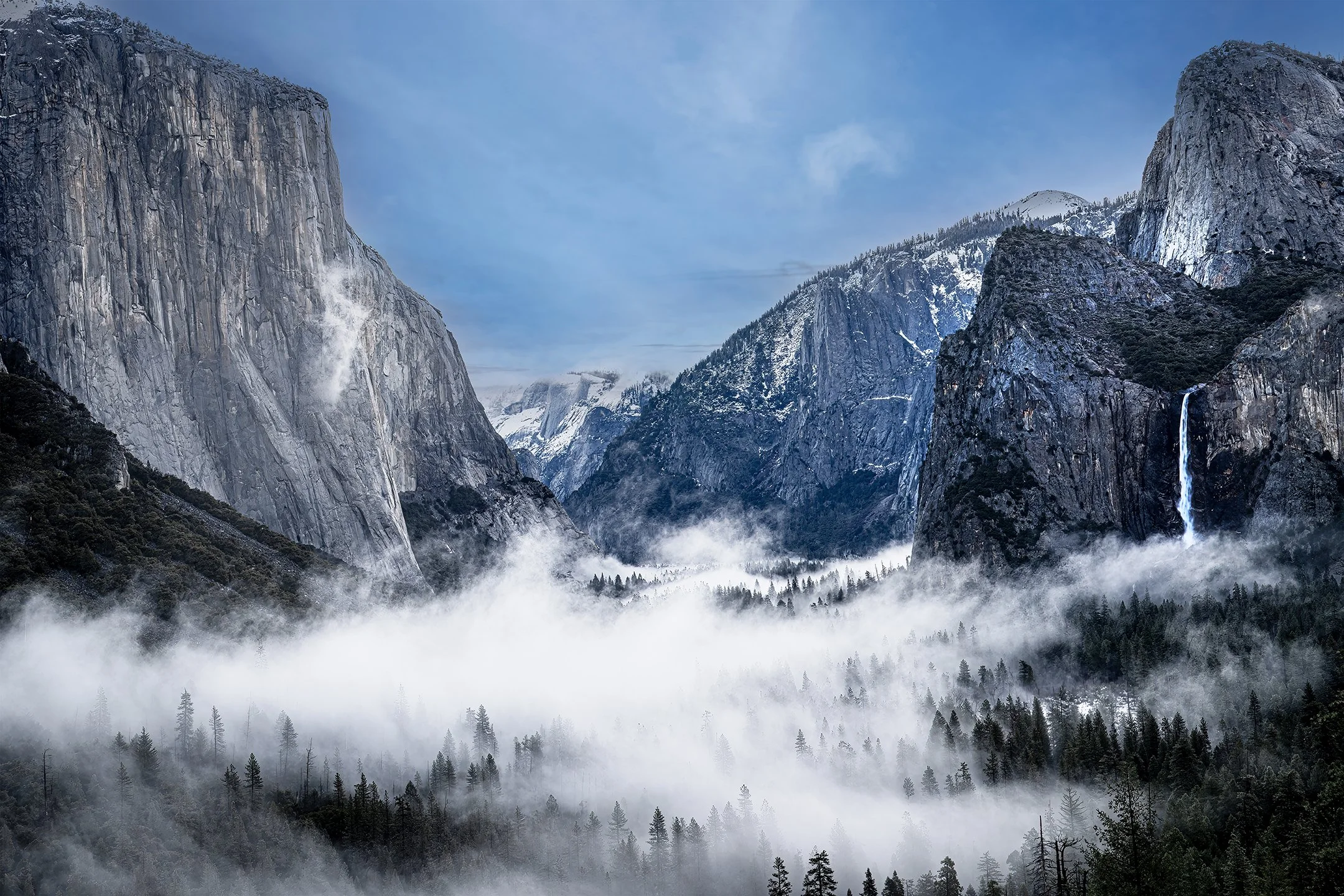 Yosemite Valley draped in ethereal fog and snow, a mystical fusion of nature's elements. 72.jpg