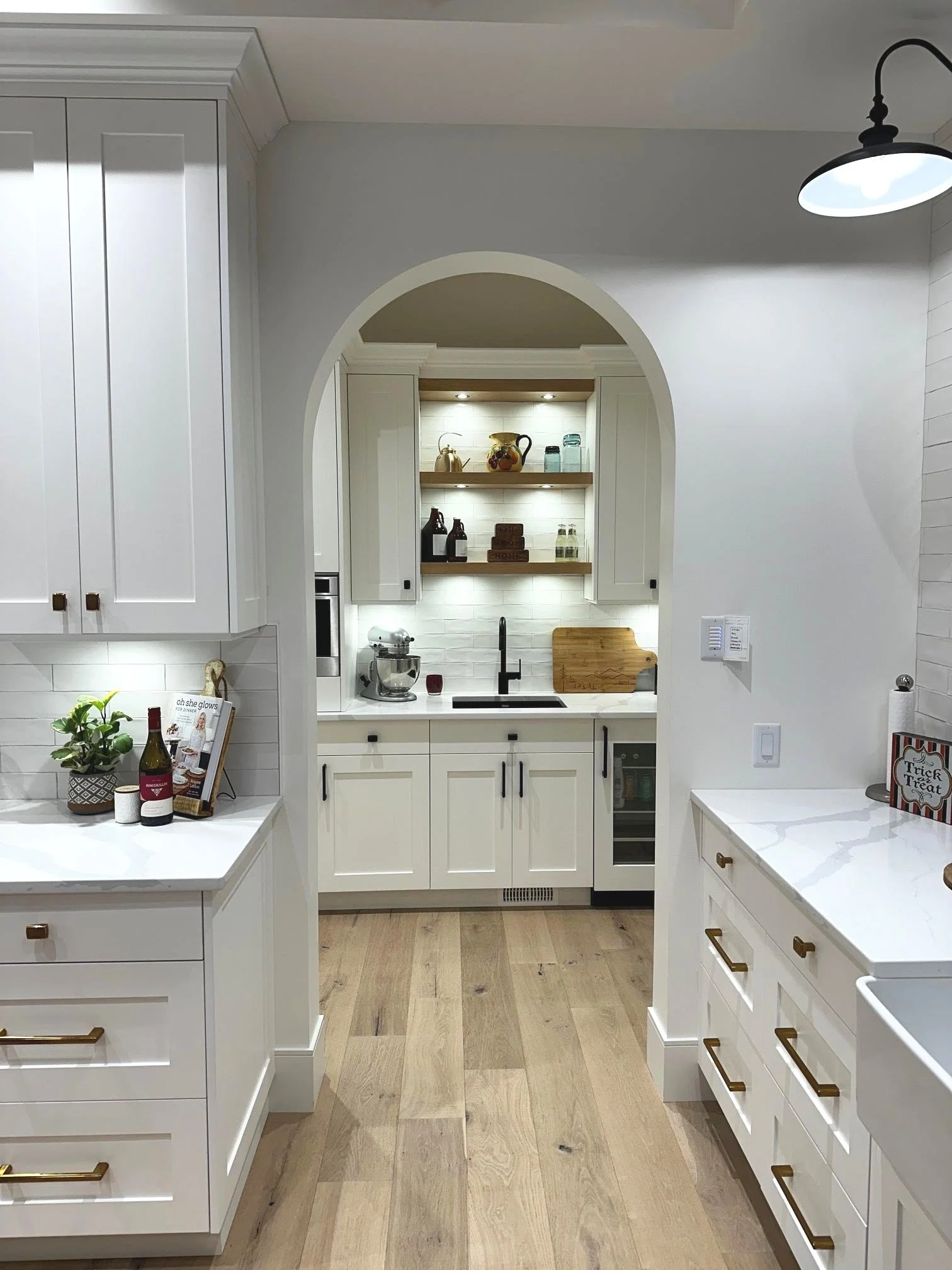 Kitchen archway leading to butler's pantry. Custom Home Build in Rose Valley, West Kelowna, BC by Pure Build Construction. 