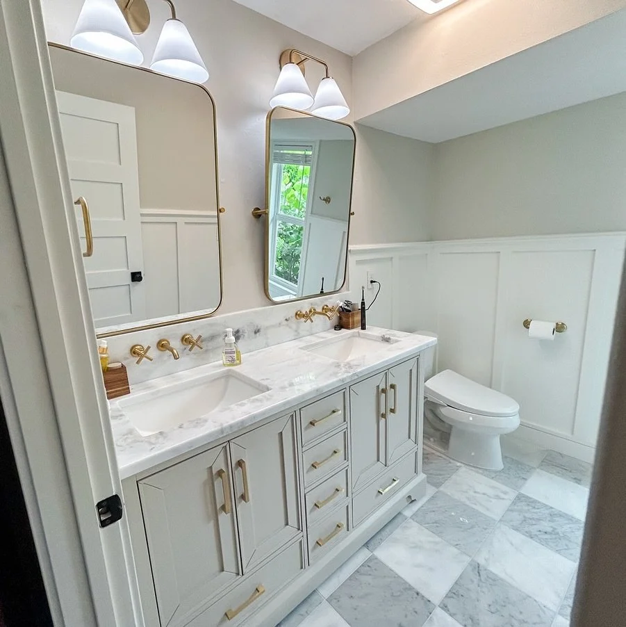 Our newest bathroom remodel features bold brass hardware, custom board + batten paneling, and a modern spin on timeless checkerboard tile. 💫
#TileUpgrade
#BathroomRemodel 
#HomeInspiration
#SWFLRemodeling 
#SouthwestFloridaHomes 
#FloridaLiving 
#Ho