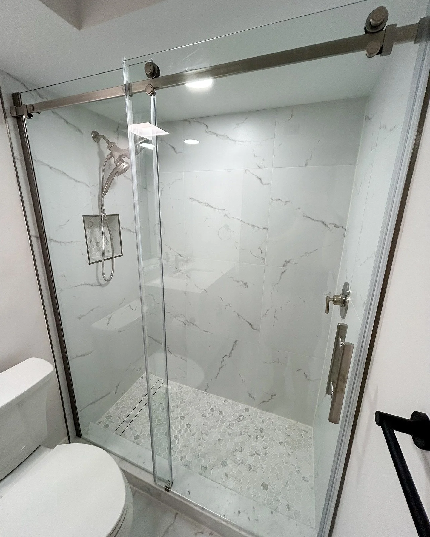 From outdated to outstanding. We replaced this fiberglass shower with fresh tile for a sophisticated, cleaner look. Ready to elevate your space? Let us bring your vision to life. 
#TileUpgrade
#BathroomRemodel 
#HomeInspiration
#SWFLRemodeling 
#Sout