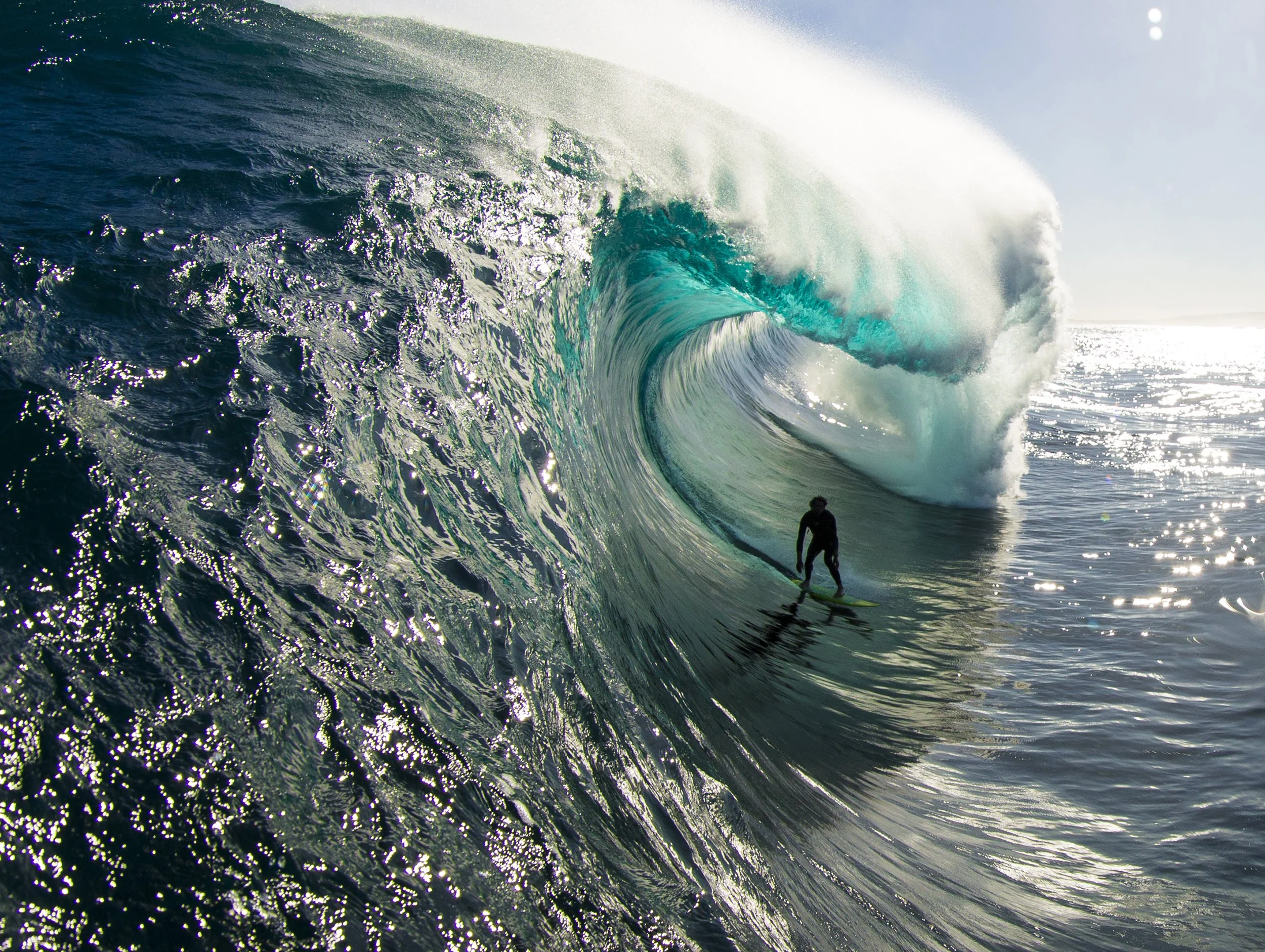 Surfer riding a large ocean wave