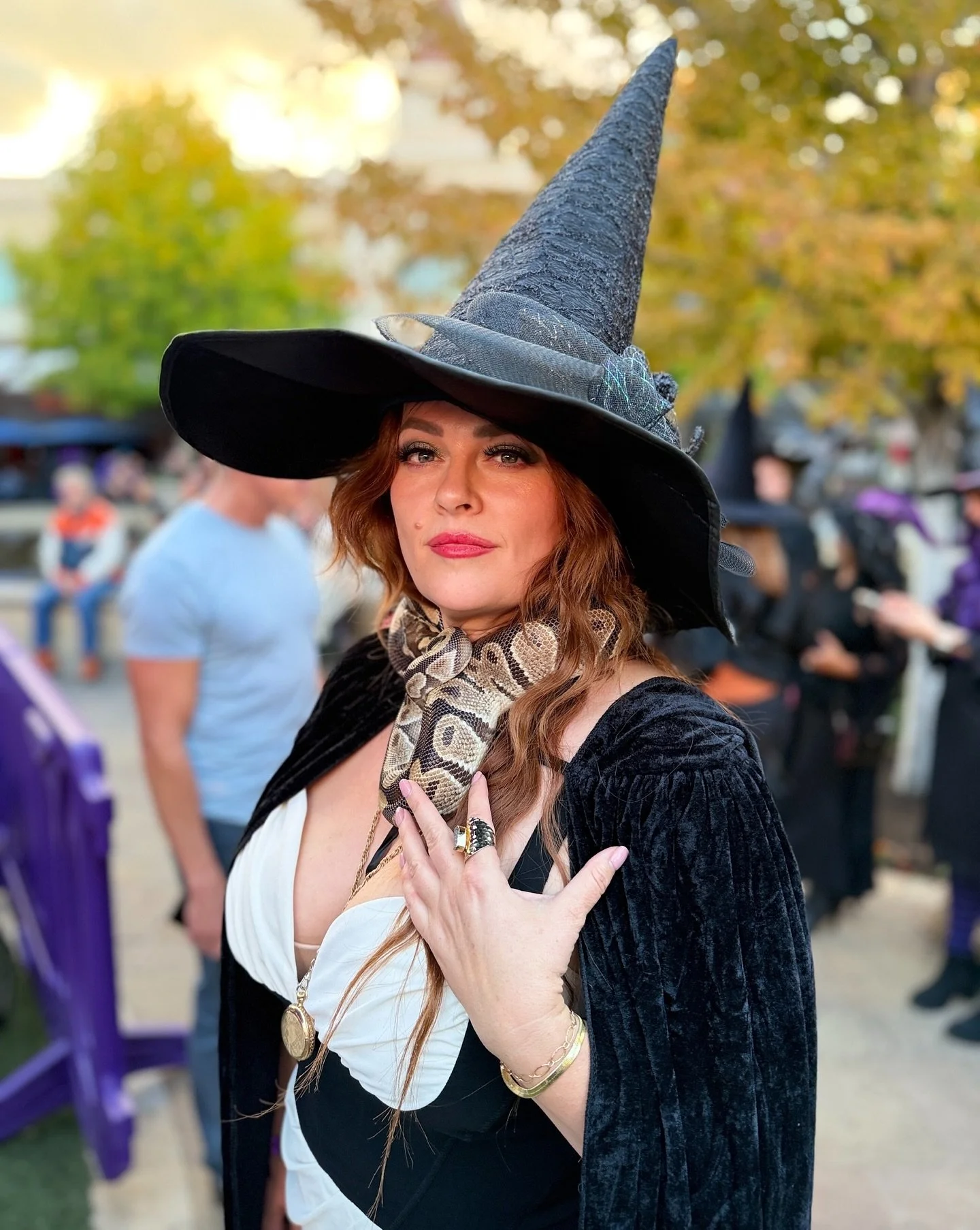 I always wear a live snake to Witches Night Out. 😉 Are you here because this is quite the party. @villageatmeridian @corbinmaxey Photo by @anjastollphoto