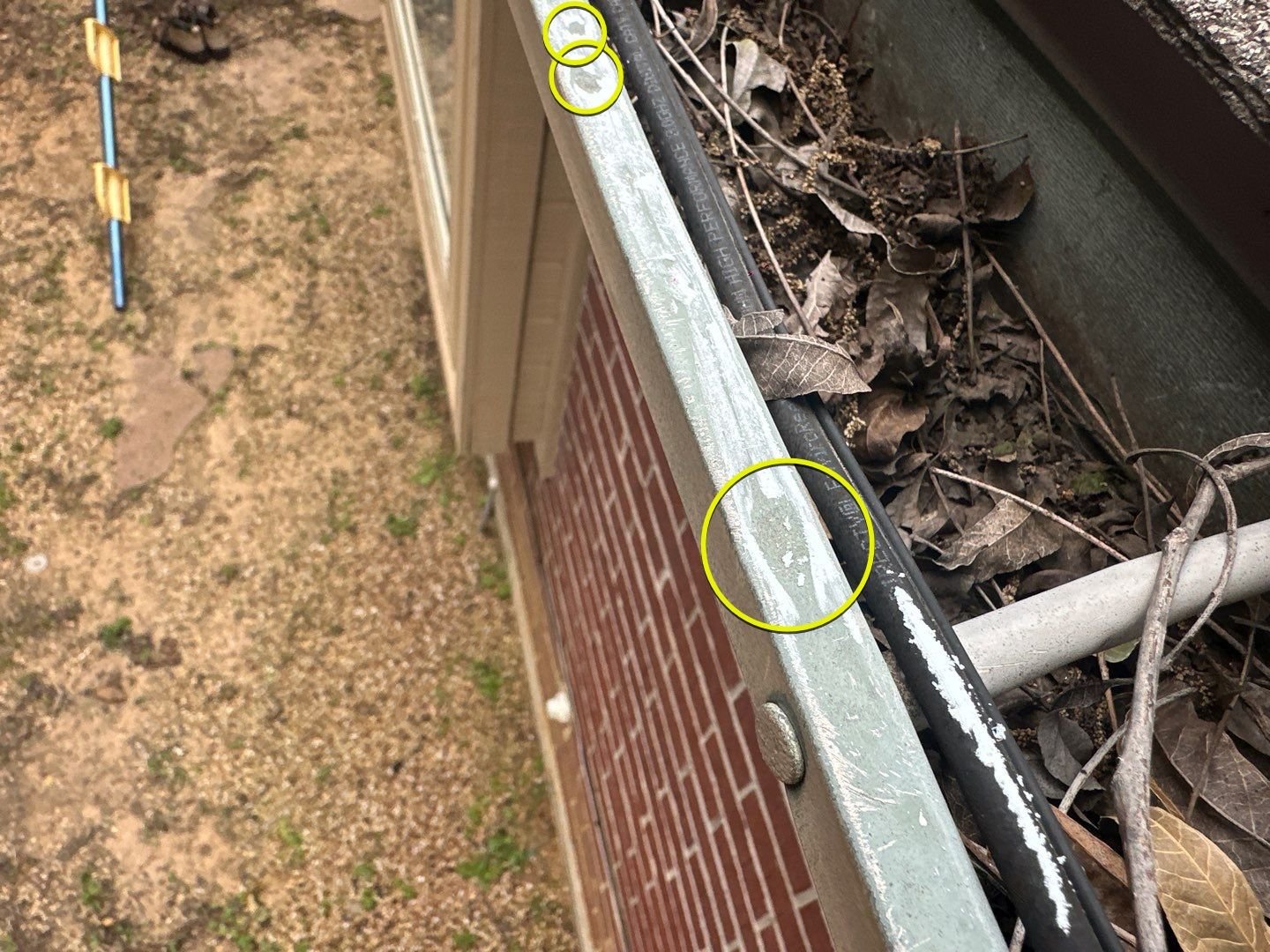 Hail damage to exterior gutter in Texas