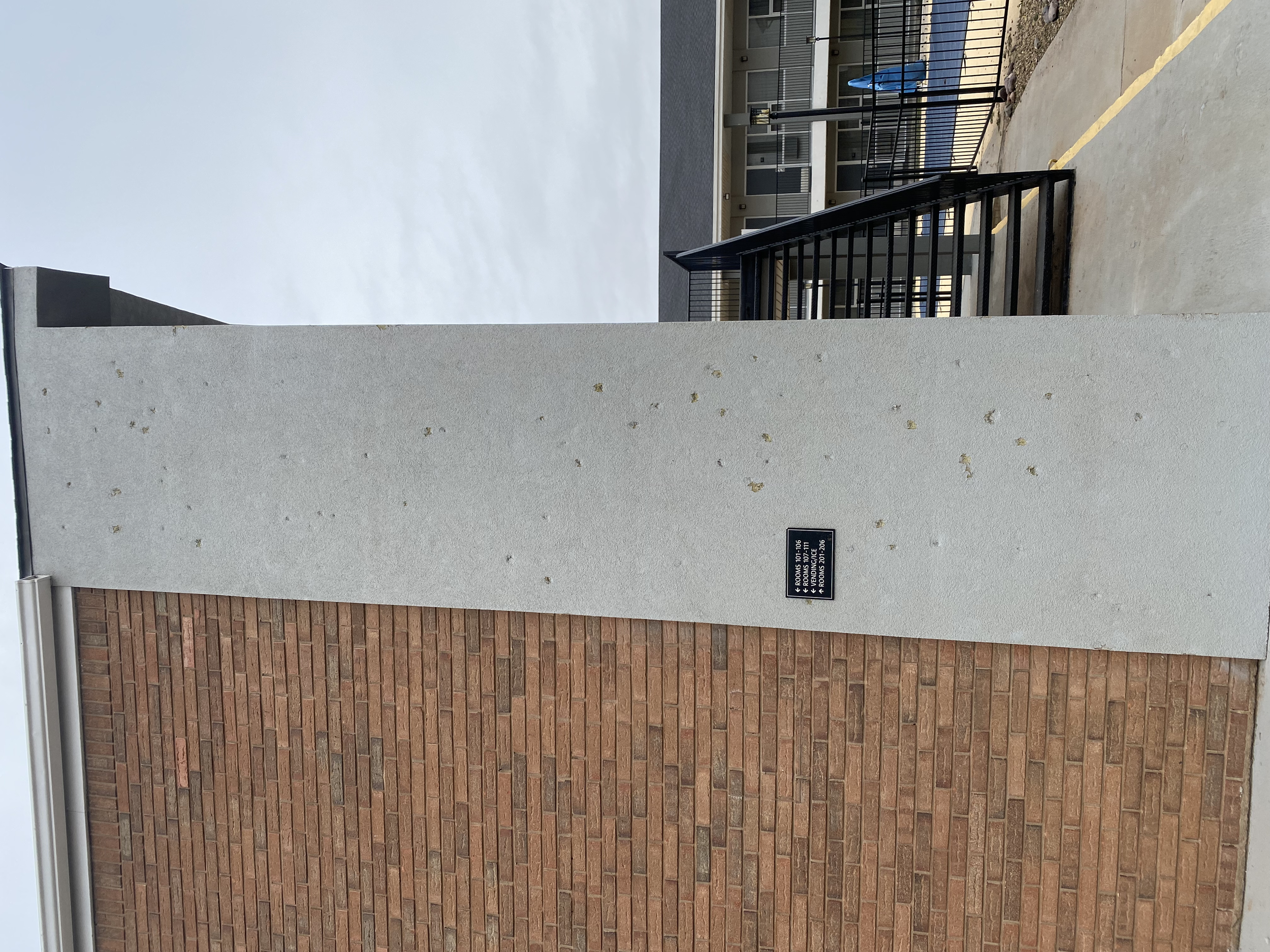 Severe hail damage to a stucco wall in Texas 