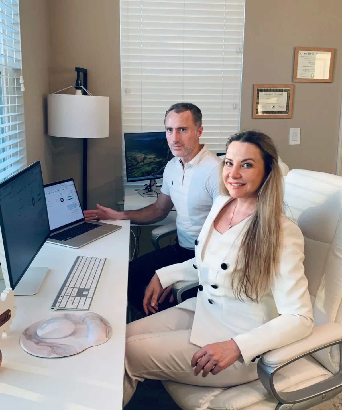 Bookkeepers reviewing financial data at a home office desk