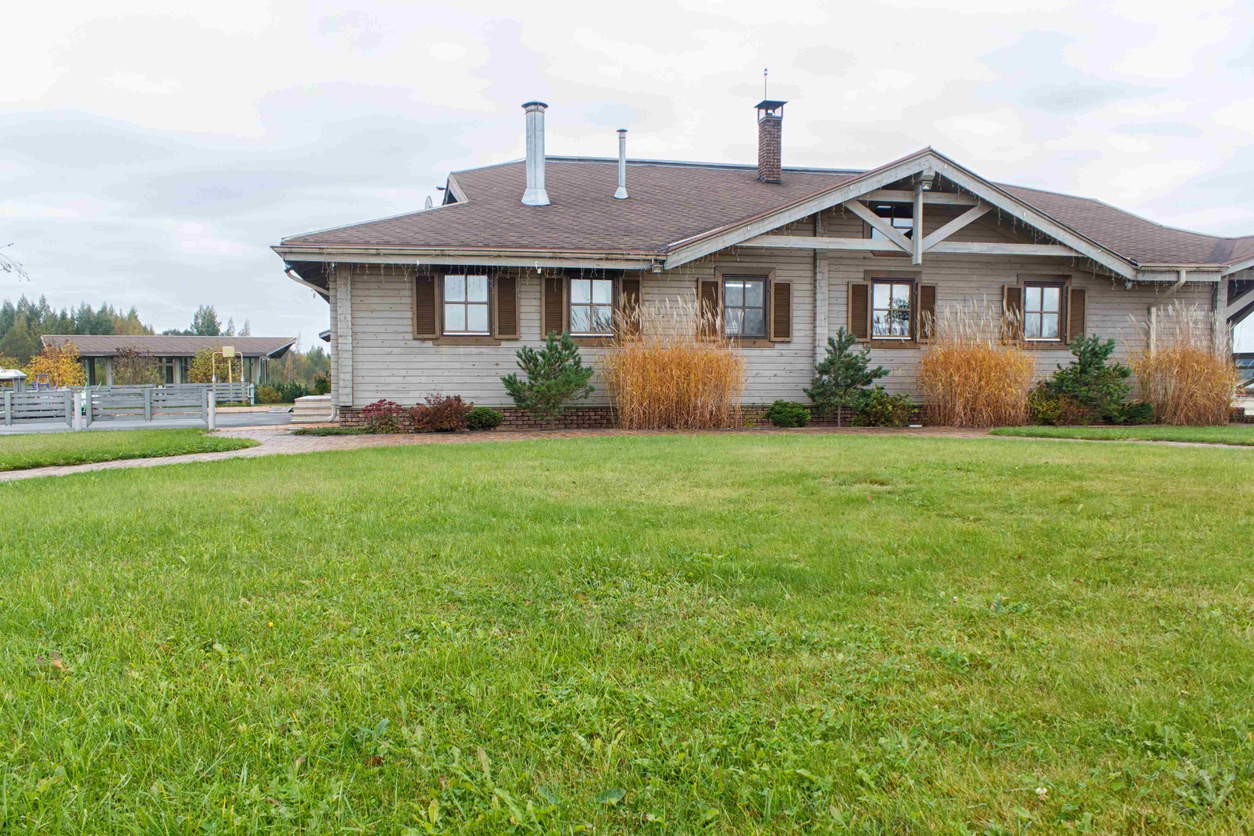 wooden-cottage-with-green-lawn-and-landscape-desig-2025-03-16-09-11-26-utc_5_11zon.jpg