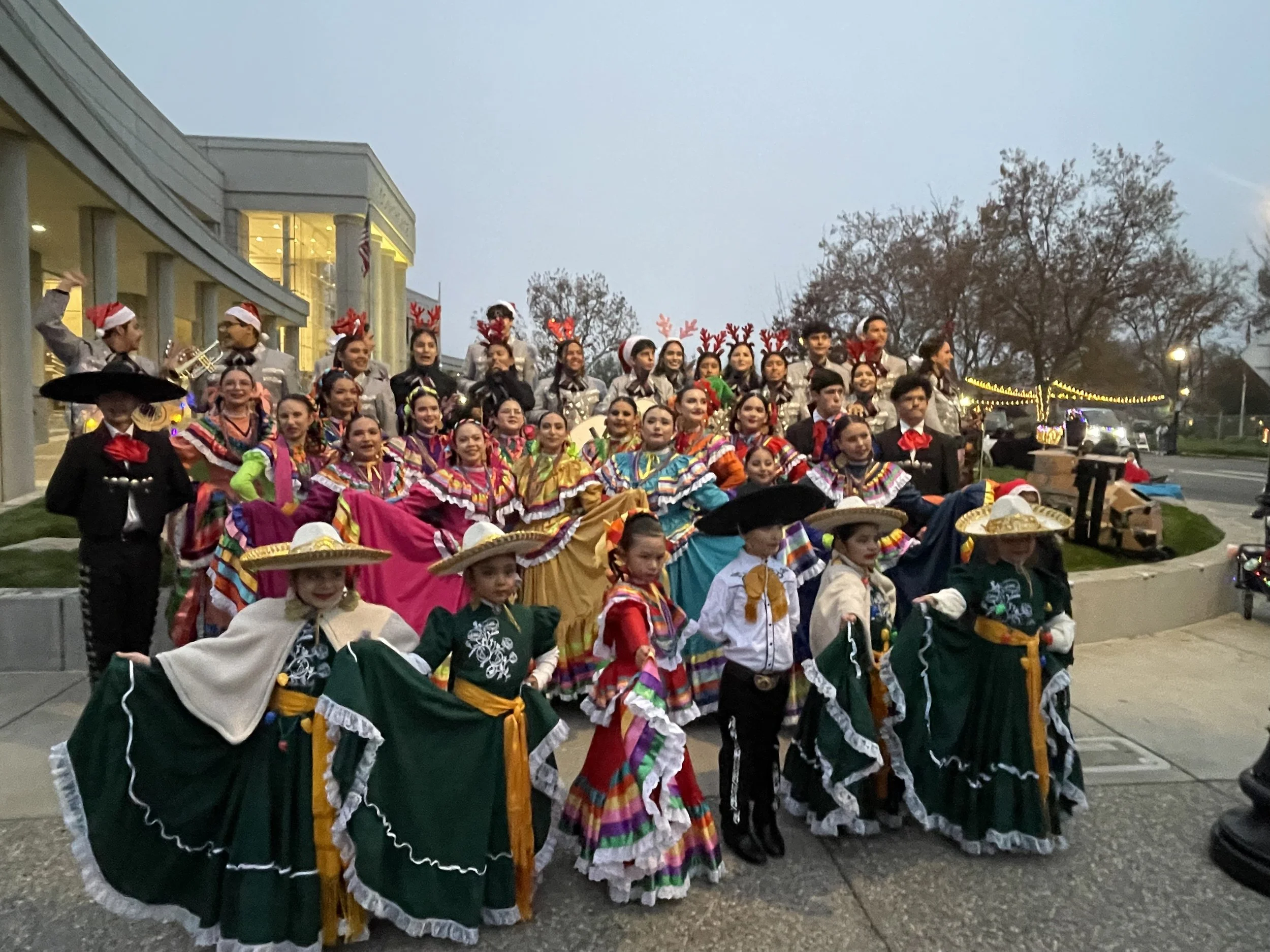 Mariachi Los Claveles and Folklorico Latino de Woodland performers in traditional Mexican attire at a community event.