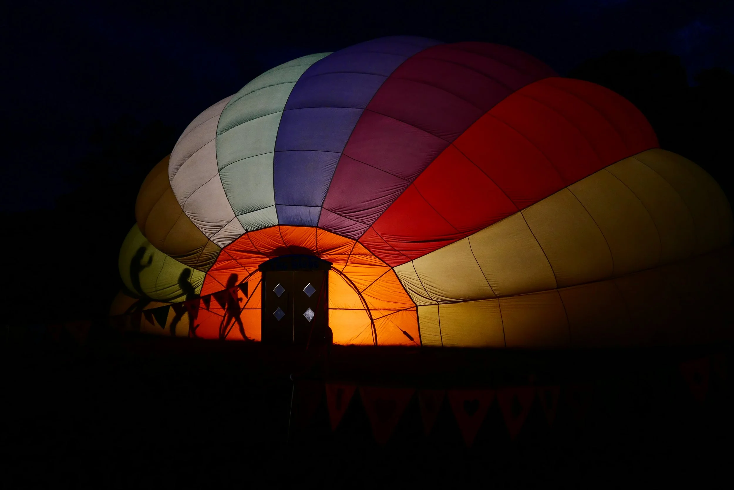hot air ballon conversion circus installation shadow silhouette rainbow lantern