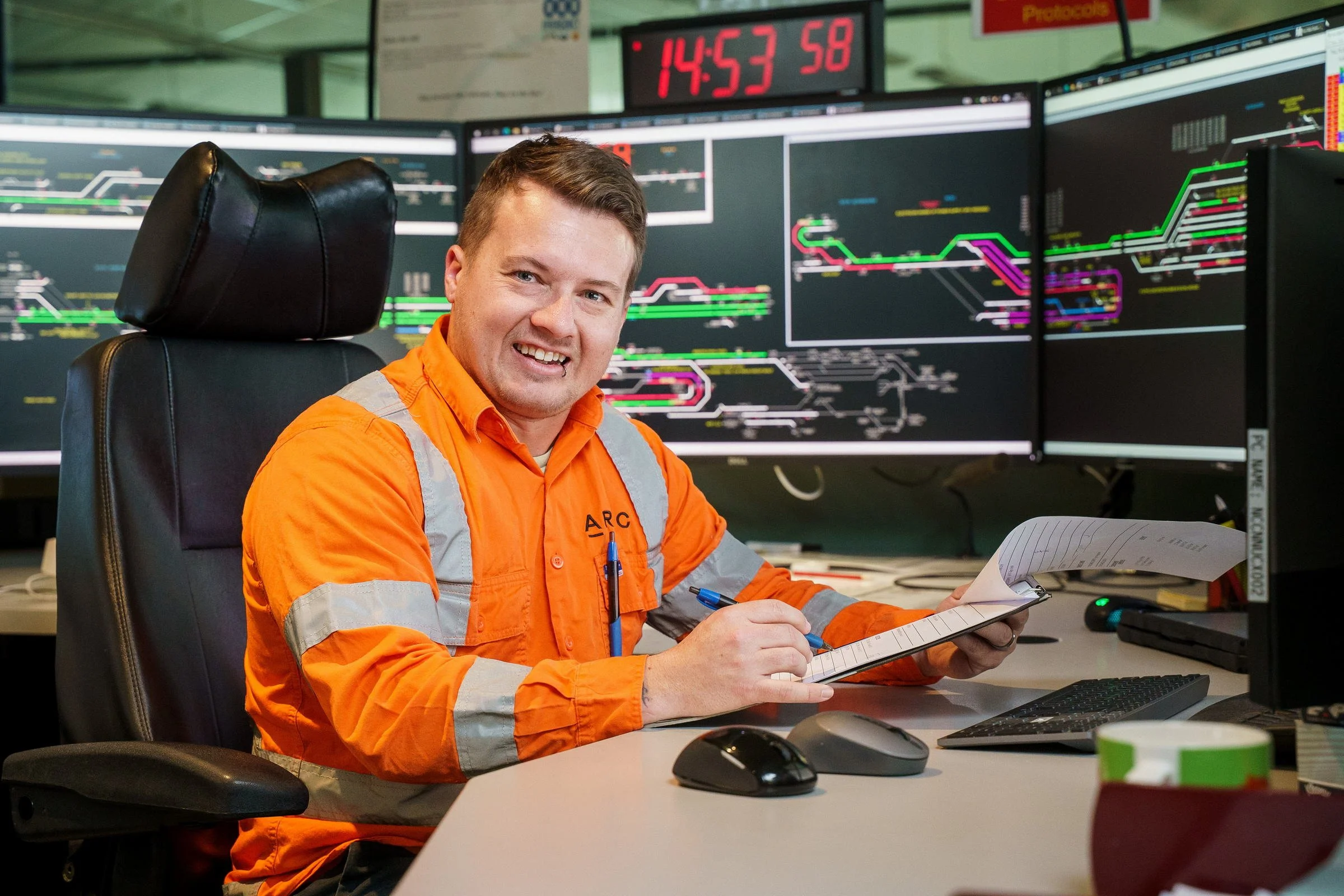 ARTC control room staff photographed in a rail network operations environment in Newcastle.