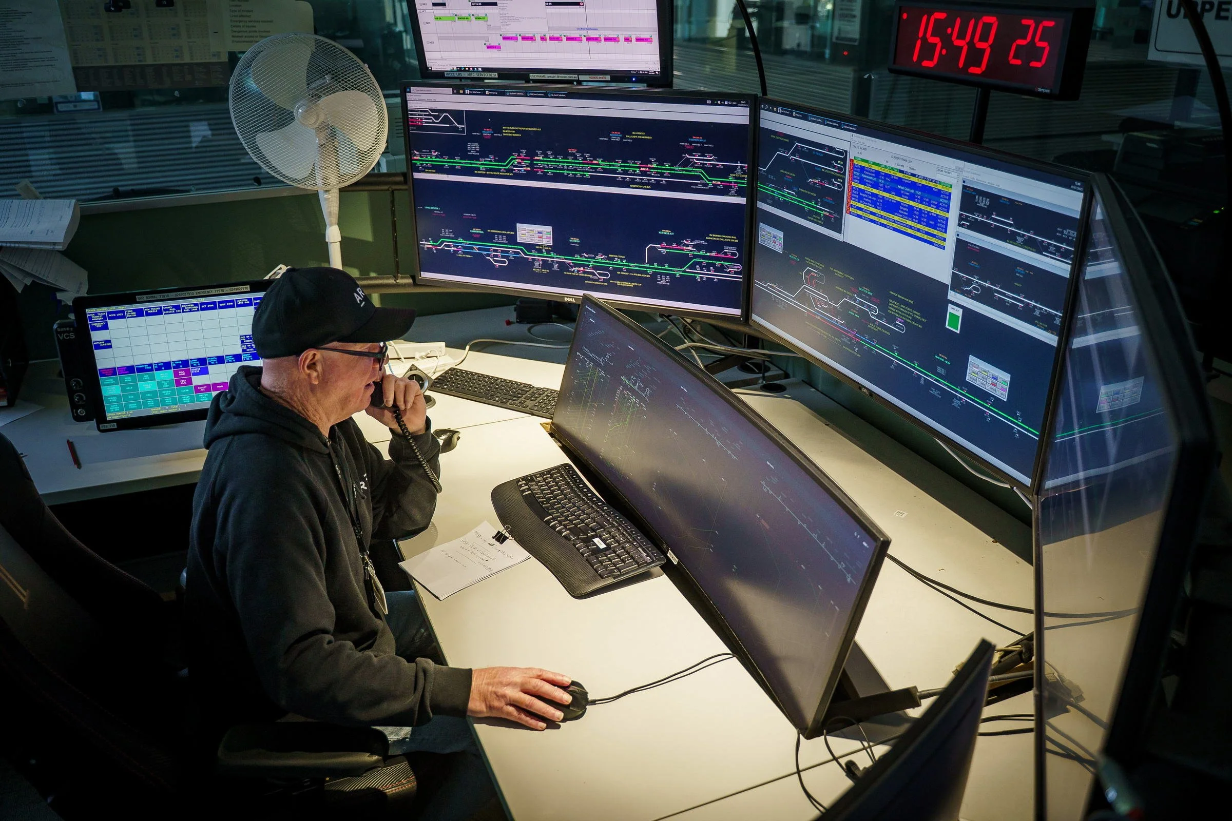 ARTC rail network controller photographed at a workstation during control room operations in Newcastle.