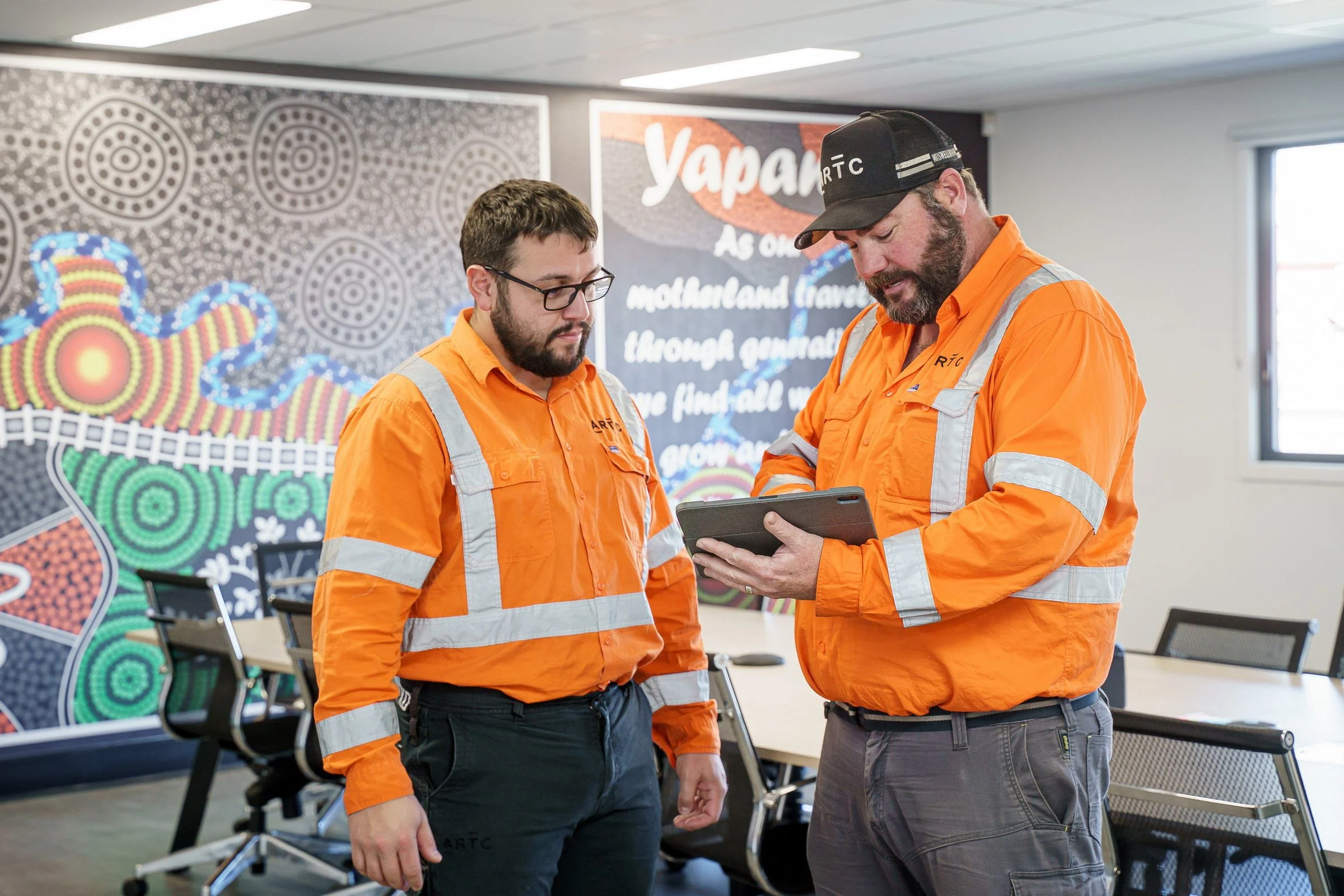 ARTC rail operations team photographed in an office environment during a corporate and industrial shoot.