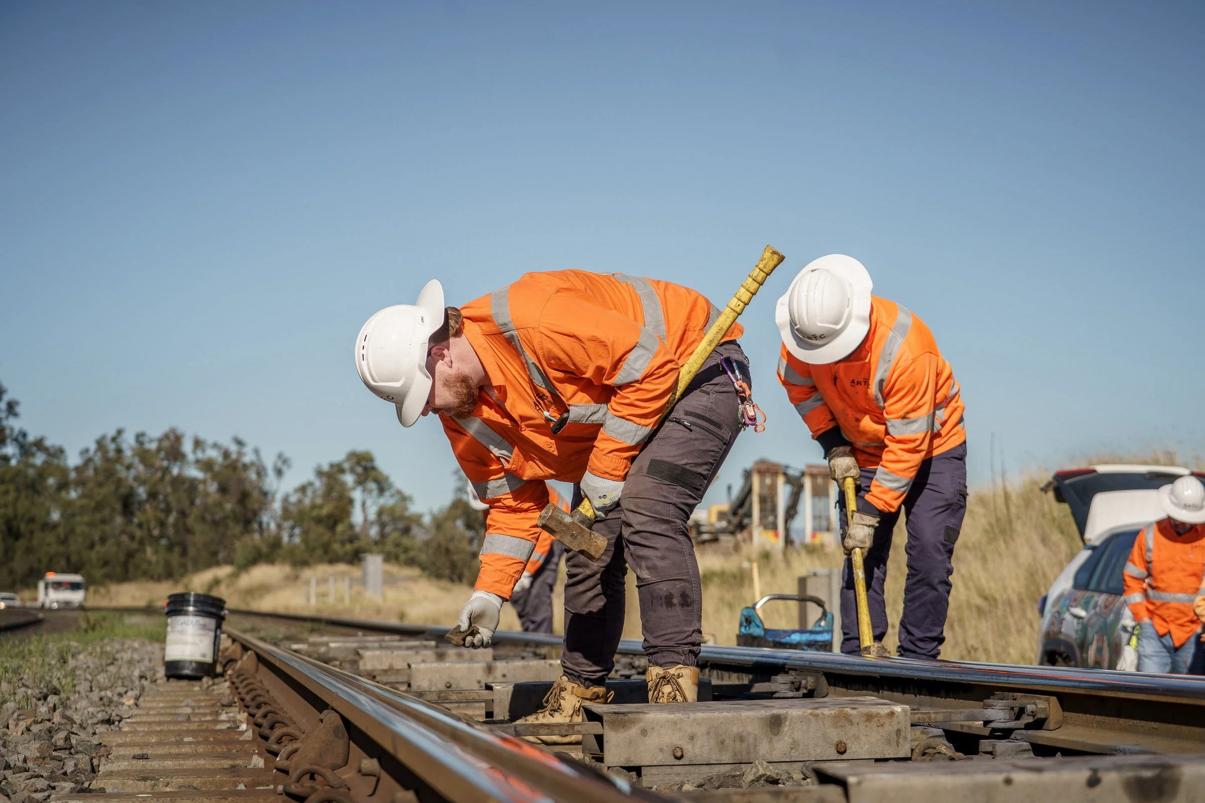 ARTC rail workers photographed carrying out track maintenance during infrastructure operations in Newcastle.