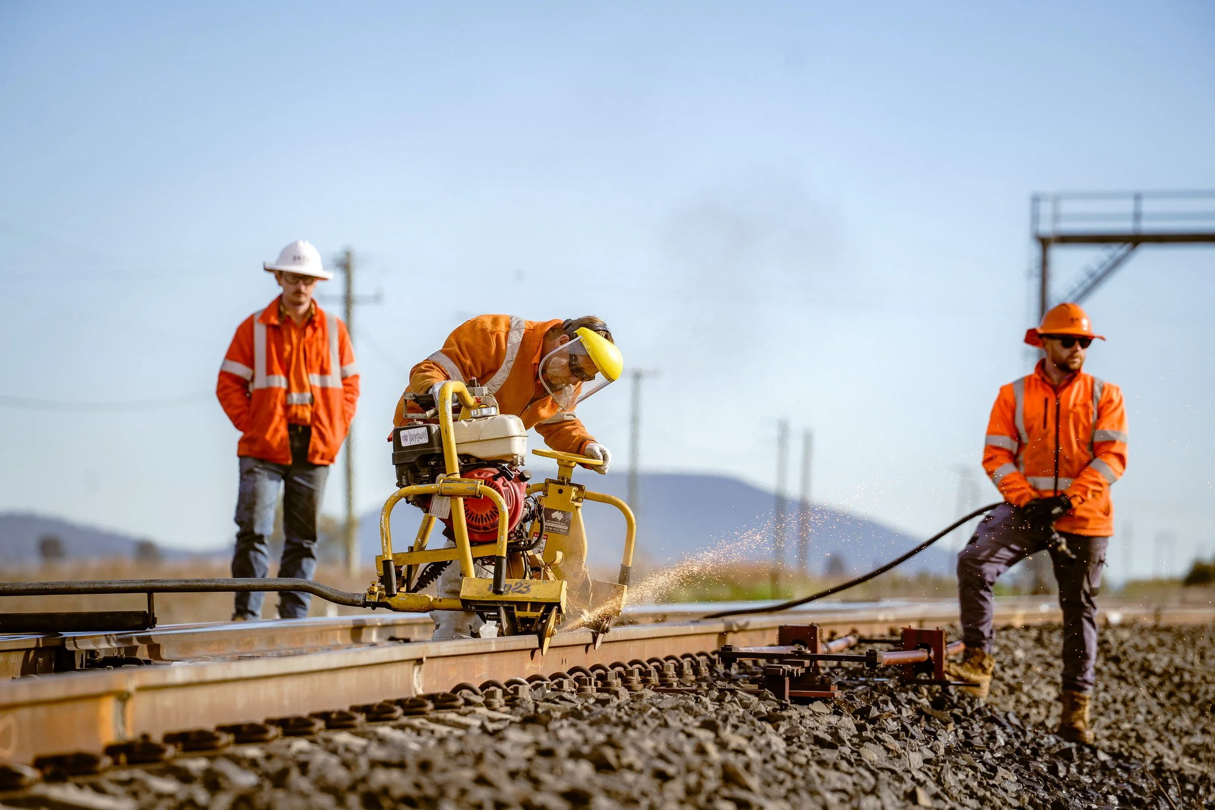 ARTC rail workers photographed on track during rail infrastructure operations in regional NSW.
