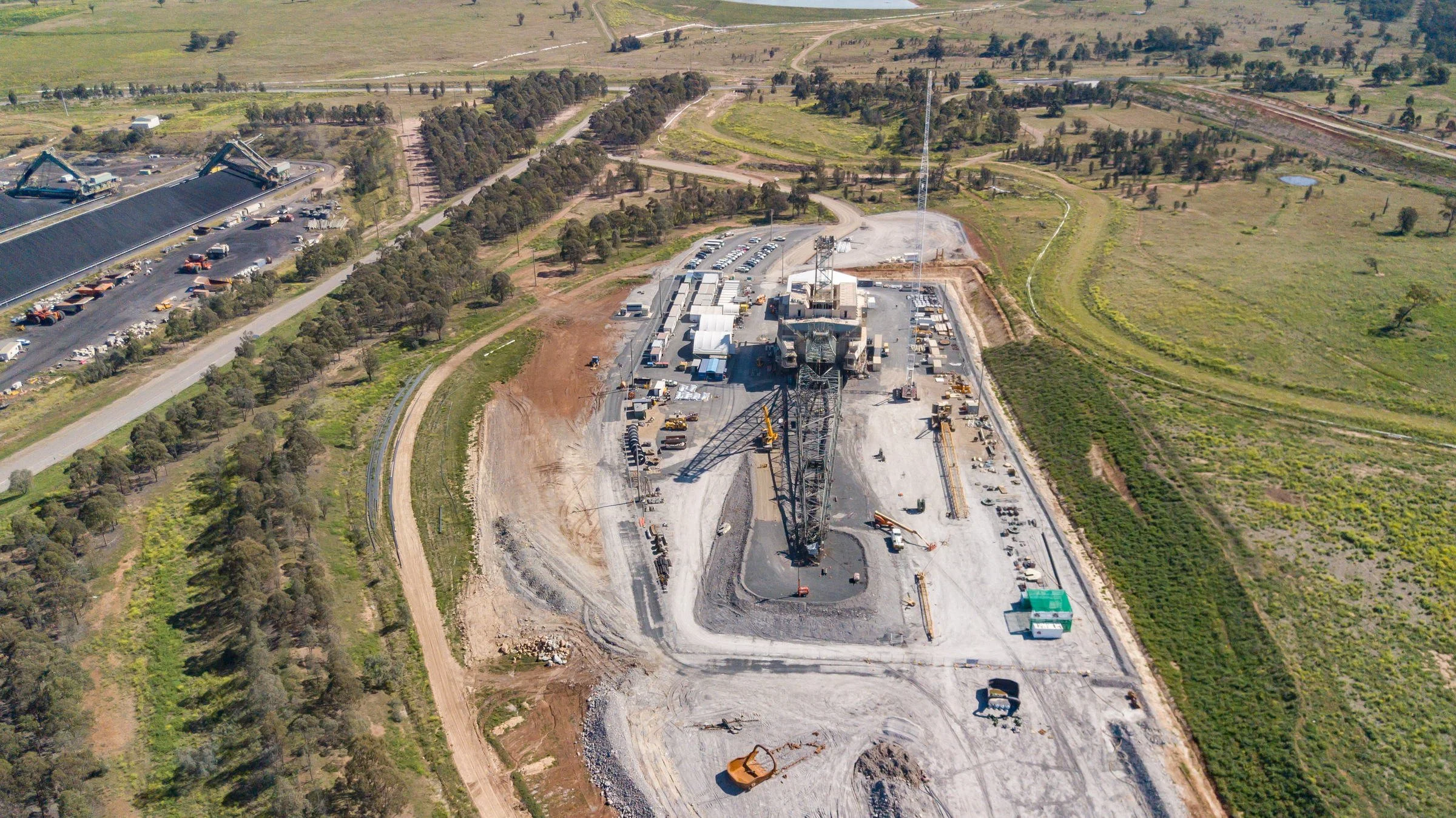 Aerial view of mine infrastructure and surrounding landscape at an open-cut mine in NSW.