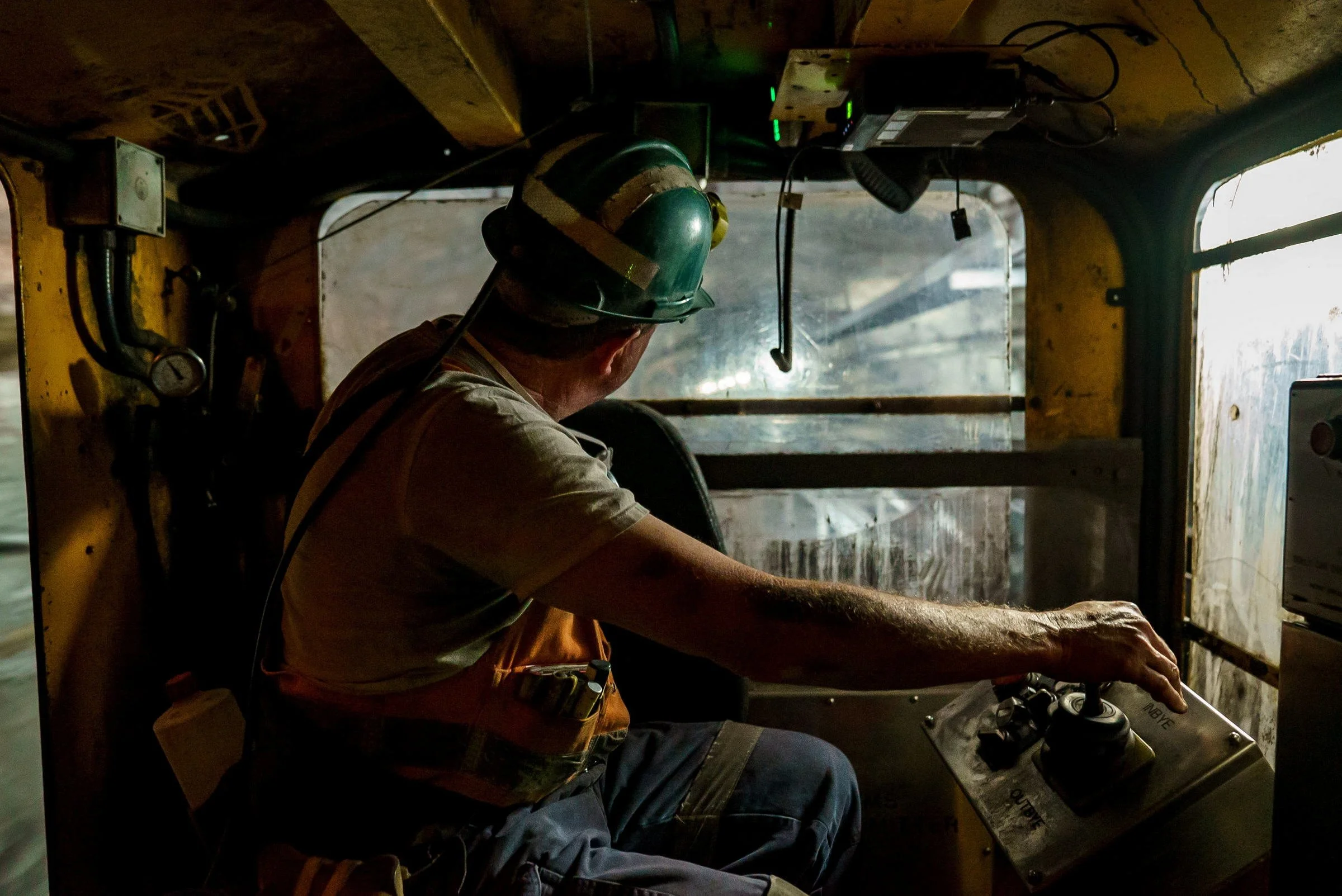Underground mine worker in a vehicle cab photographed at Myuna Mine in NSW.